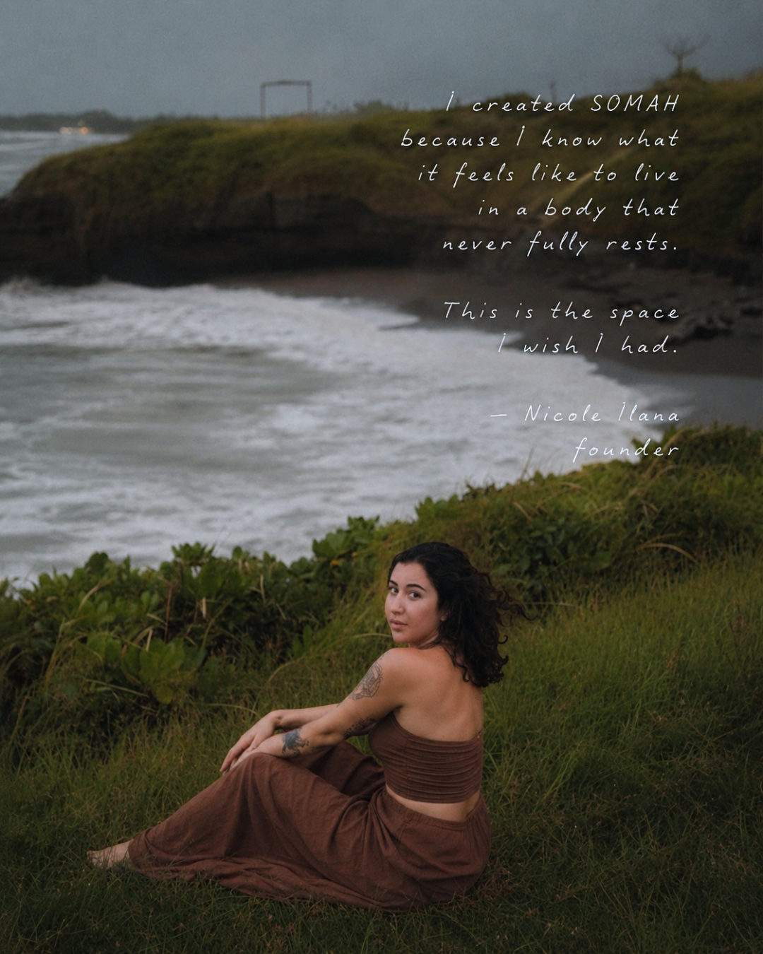 A woman sitting on grass near a cliff overlooking the ocean with waves crashing below, during dusk or dawn. A quote about feeling restless in a body is overlaid on the image.