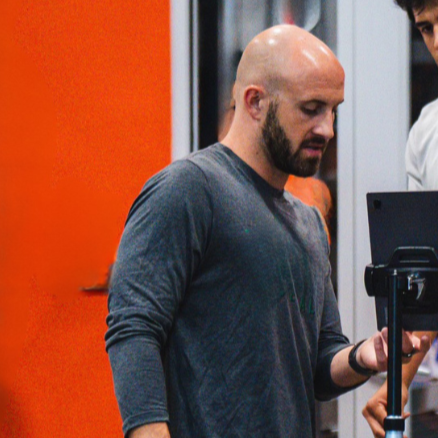 Tommy Otley utilizing performance metrics and sports science data to enhance athlete performance. 