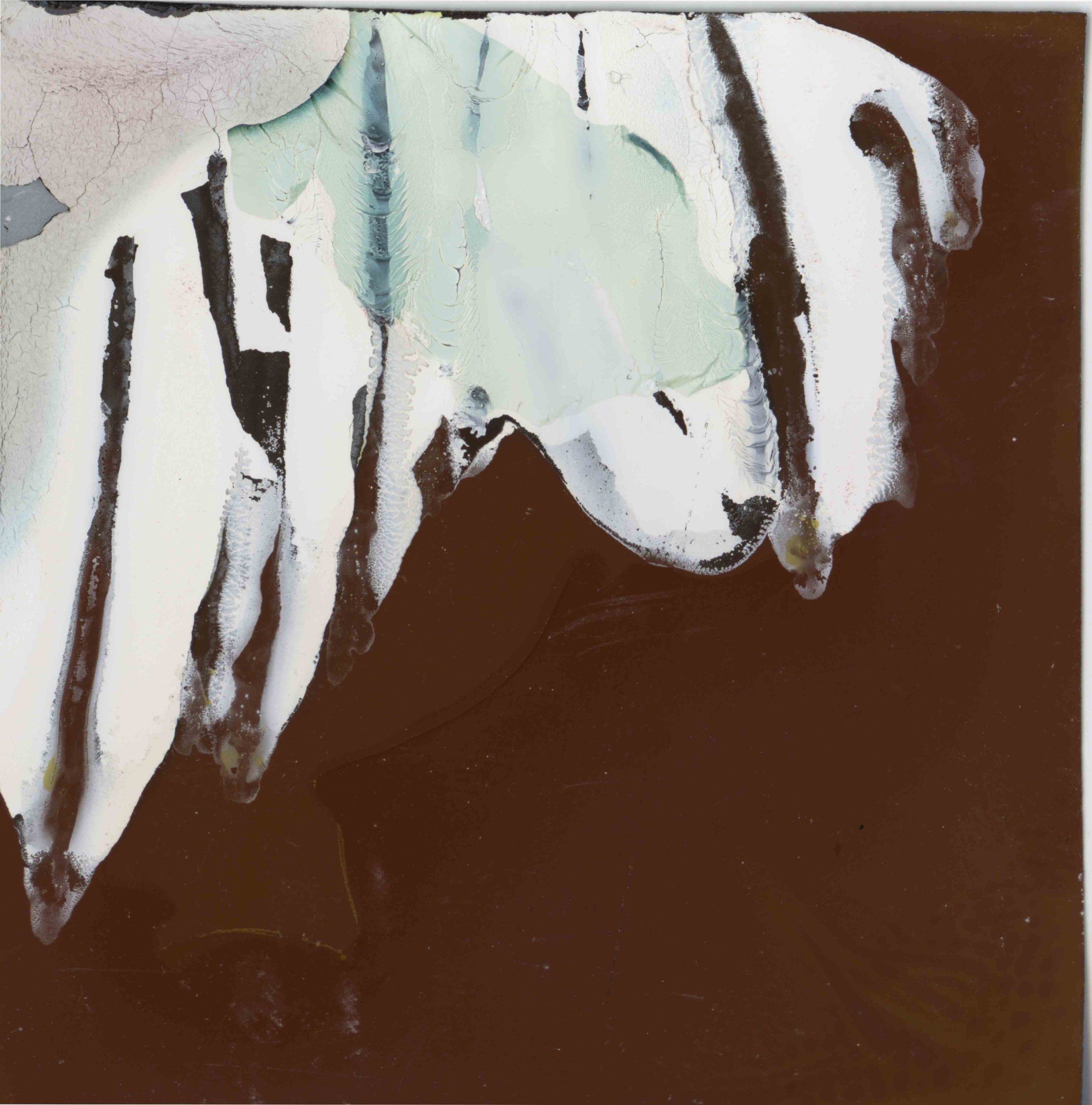 Abstract artwork featuring black, white, and greenish colors with flowing and cracked textures.