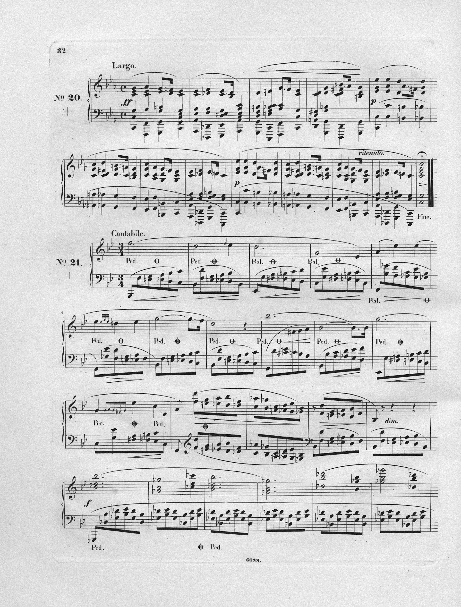 Sheet music for a piano composition, indicating tempo markings such as Largo and Cantabile, with musical notes and annotations.