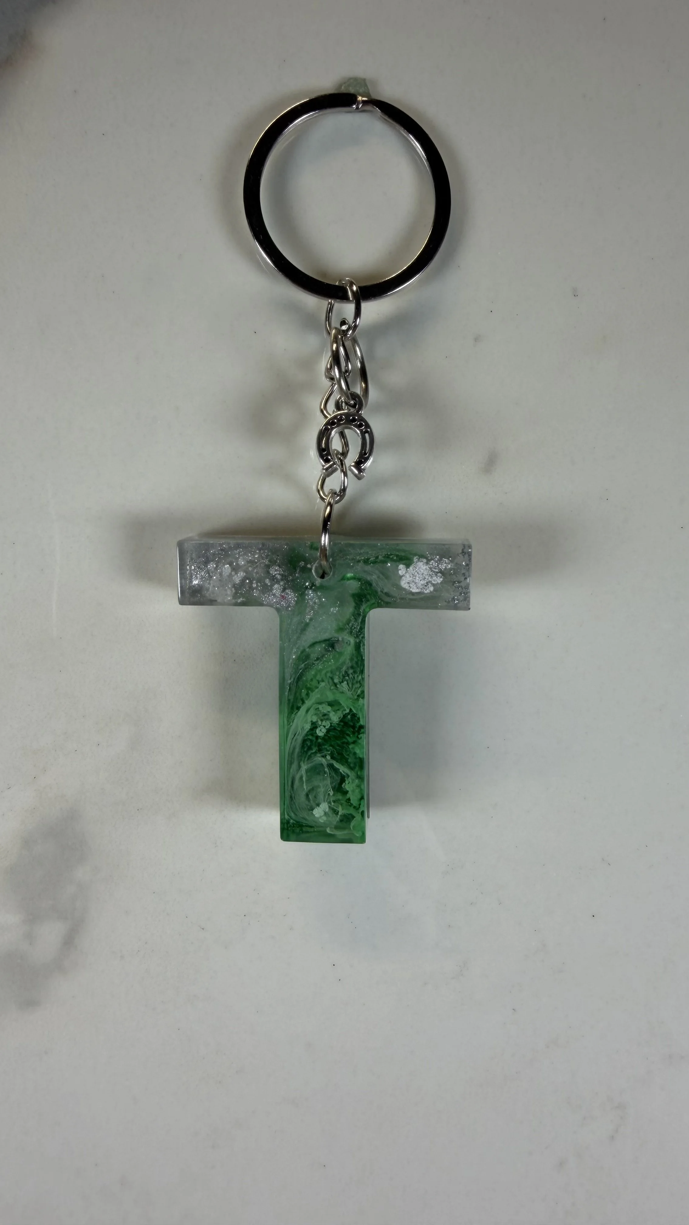 Green & Silver ‘T’ Resin Keychain with Horseshoe Charm