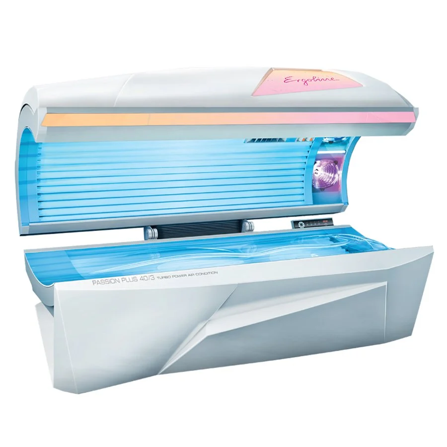 A modern tanning bed with a white and blue design, featuring a pink label on top that says 'Engelina' and a closed lid.