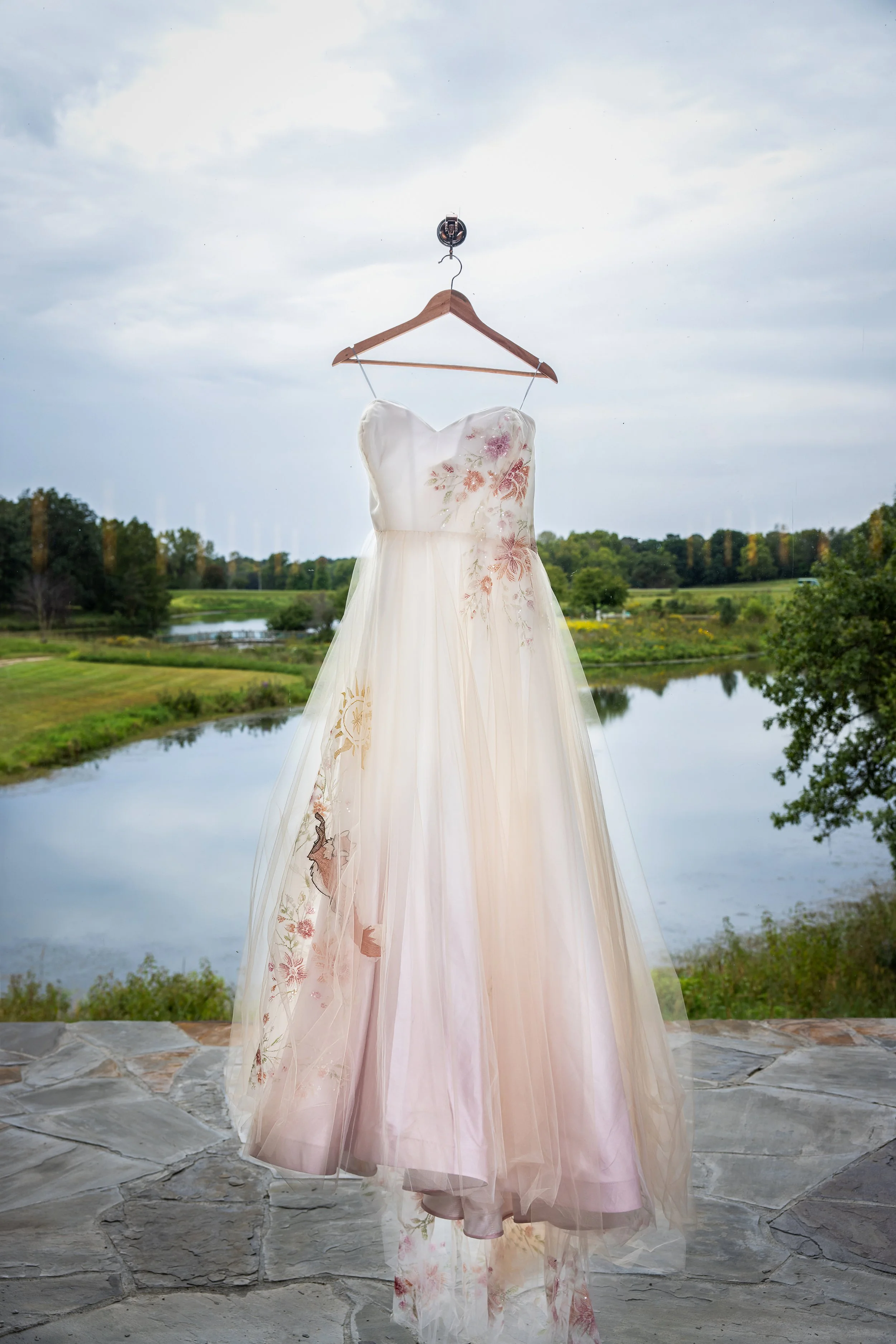Wedding Dress Hanging in Window at Powell Gardens