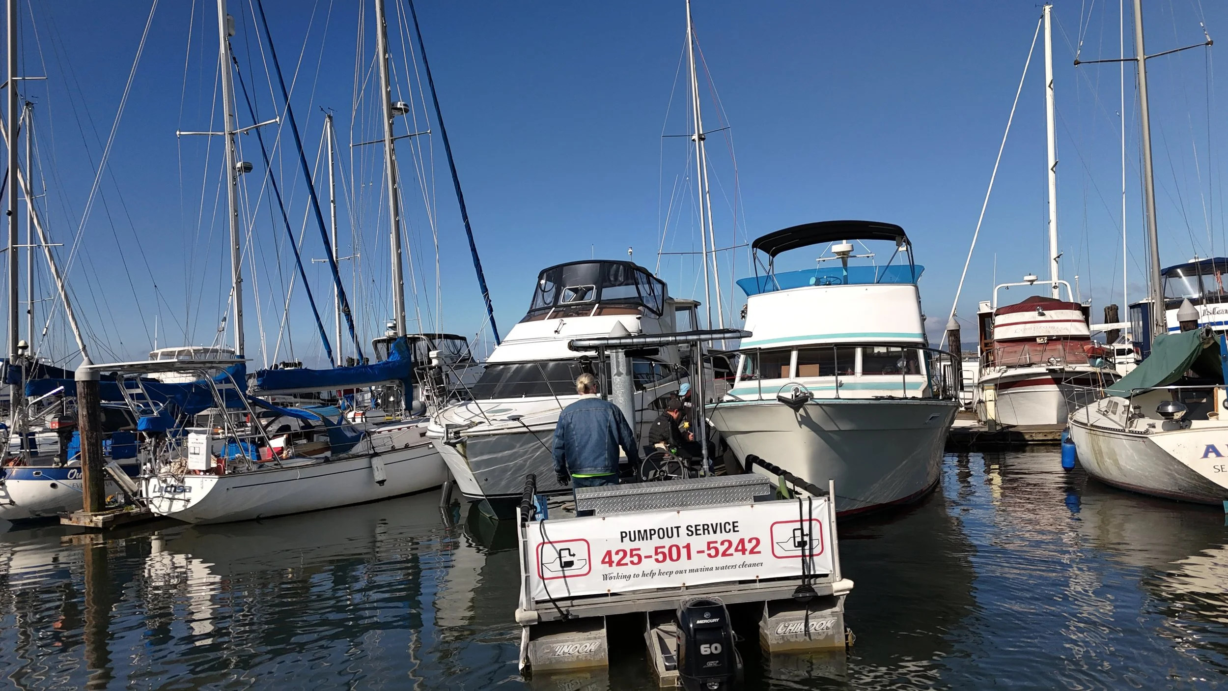 Marina with docked boats served by Rose Enterprises marine holding tank pump-out service at Everett Marina.