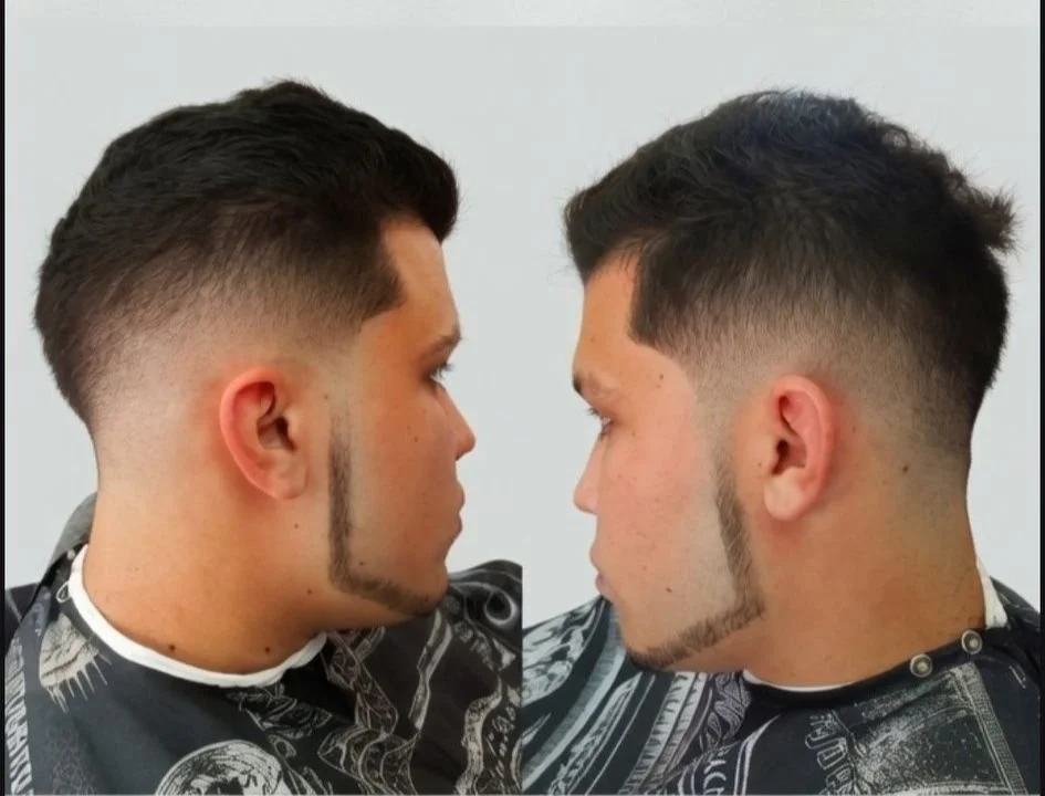 Two men with identical short hairstyles, featuring high fade cuts and angular beard lines, facing each other in a barbershop.