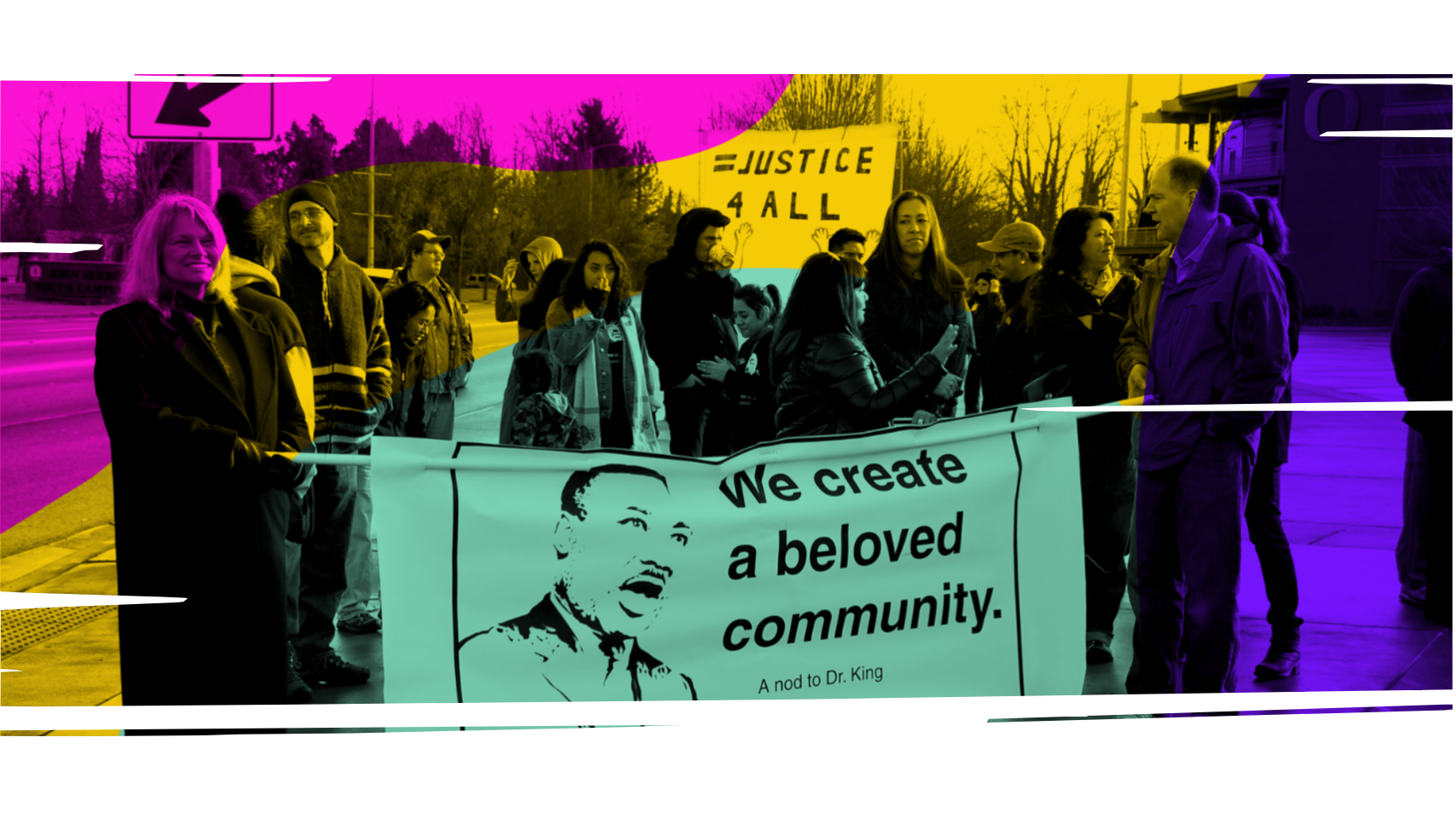 Group of protesters holding signs, one with a silhouette of Martin Luther King Jr. and the words "We create a beloved community," with NAACP Eugene-Springfield, Oregon