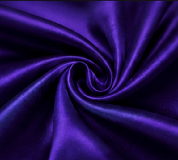 Close-up of purple satin fabric twisted into a spiral.