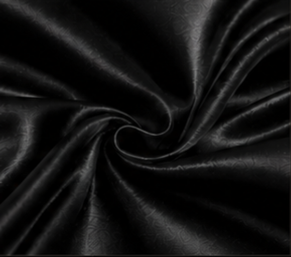 Black fabric with a subtle floral pattern, gathered in the center.
