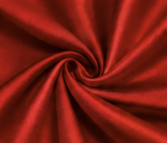 Red fabric twisted in a spiral pattern.