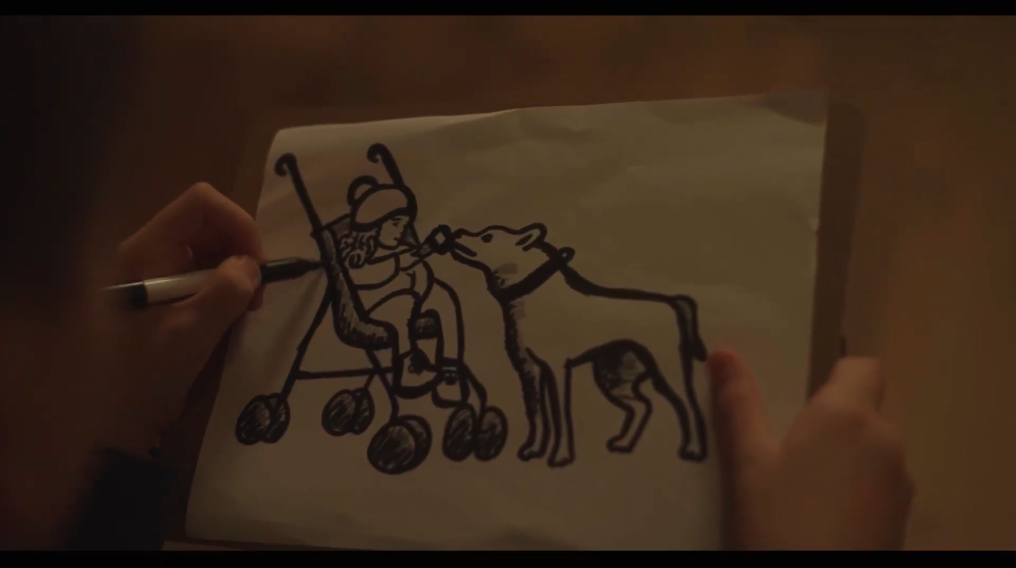 Dessin d'un enfant en fauteuil roulant donnant à manger à un chien.