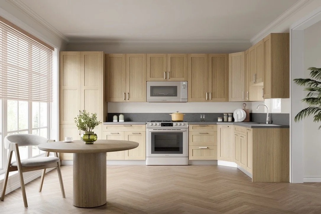 Modern kitchen with light wood cabinets, a white stove, microwave, window with blinds, round dining table with a green vase and plant, and hardwood floors.