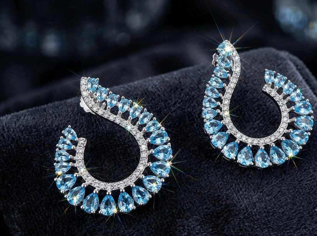 Sterling Silver Swirl Earrings — Blue Topaz