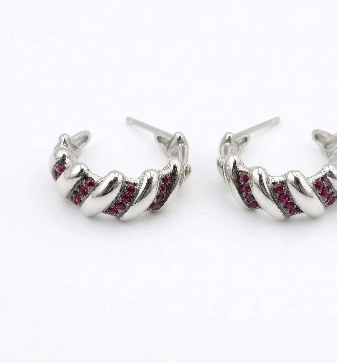 Sterling Silver twisted hoop with ruby/pink accents