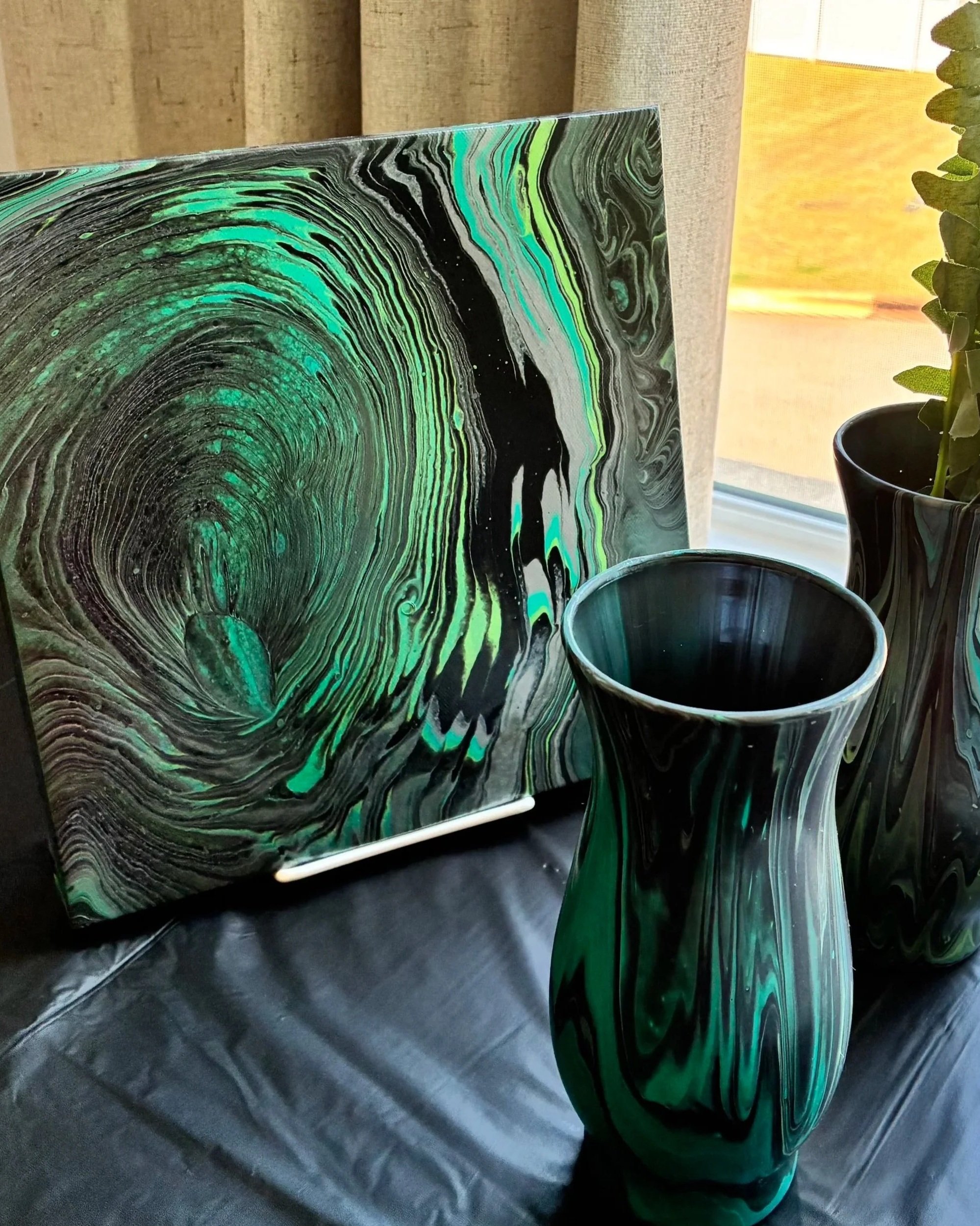 Abstract acrylic pour canvas featuring emerald green, black, and deep teal flowing marbled movement from the Obsidian Vein Collection by DesignsbyLadia