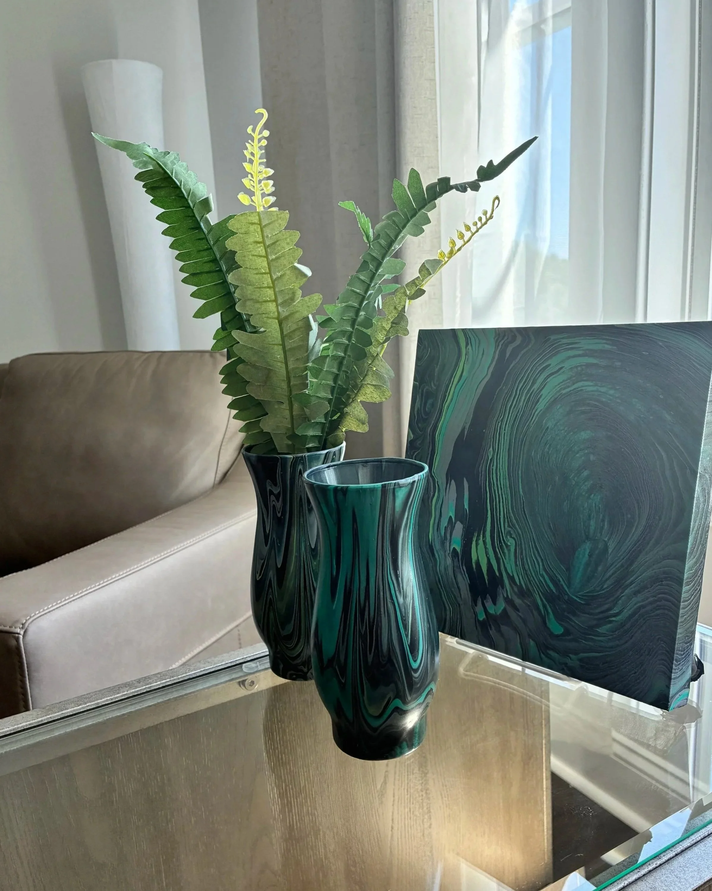 Hand-poured abstract artwork with rich emerald veining and glossy black contrast, paired with a coordinating decorative vase for a bold, curated statement. One-of-a-kind original by DesignsbyLaDia..