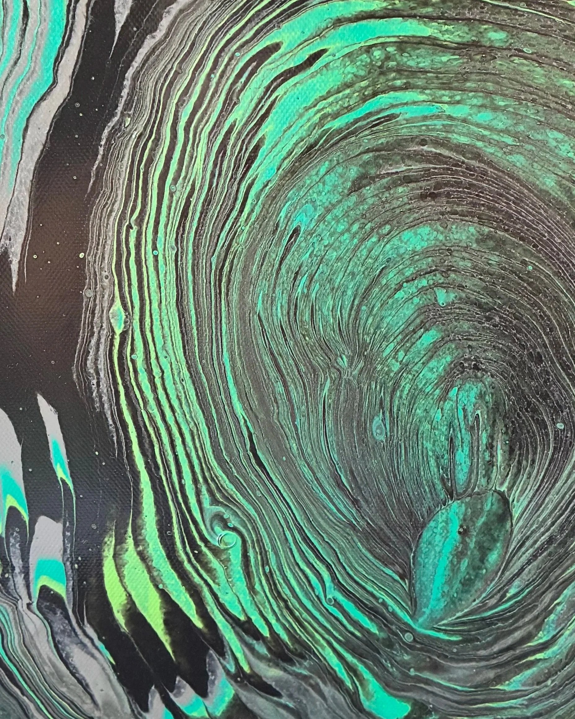 A striking close-up from the Obsidian Flow Collection featuring layered emerald, charcoal, and black movement inspired by natural stone and fluid motion. Designed to bring depth, mood, and modern luxury into any space.