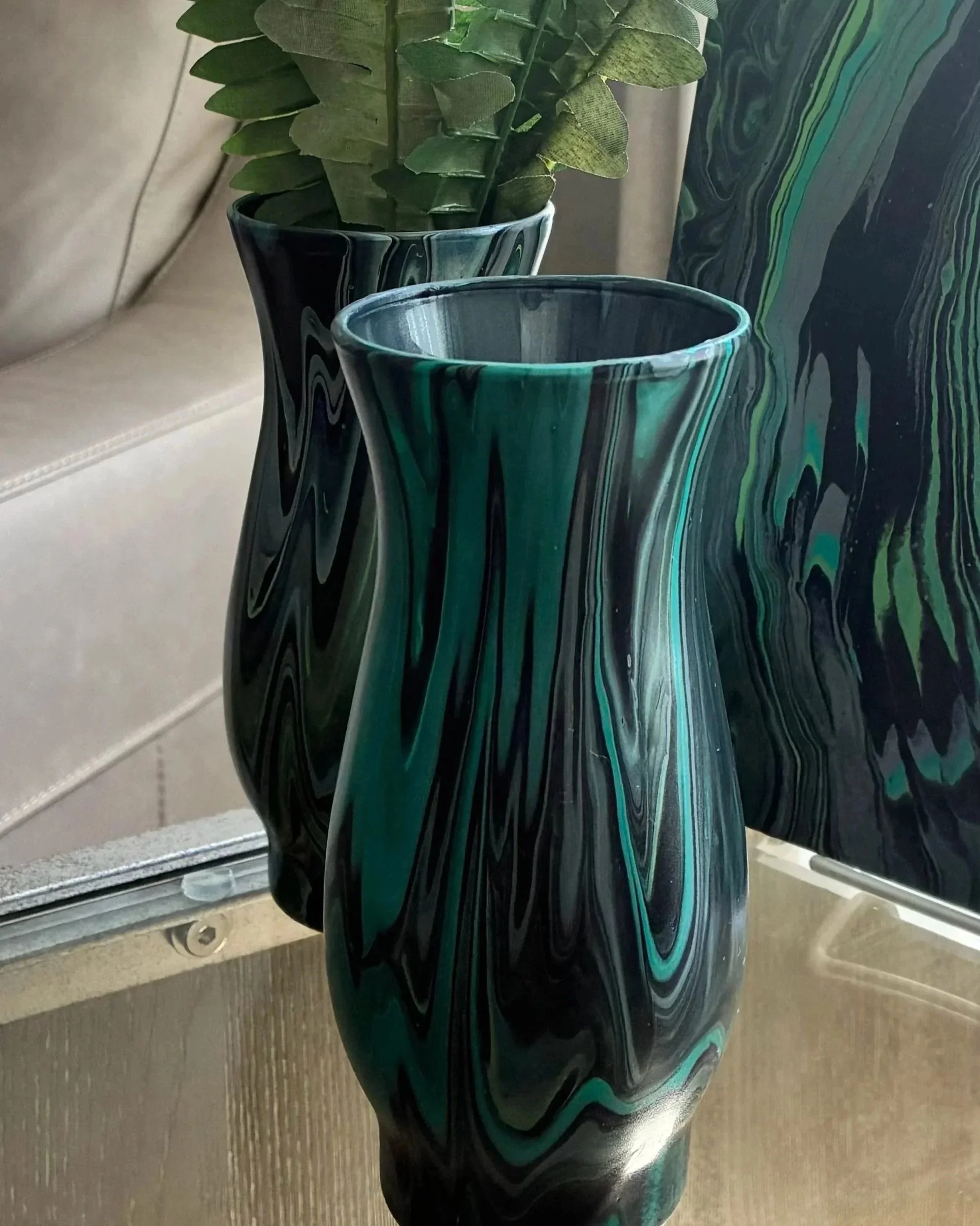 Part of the Obsidian Flow Collection, this handcrafted piece explores movement and contrast through fluid abstract design. Created to evoke emotion while elevating modern spaces with rich, moody texture