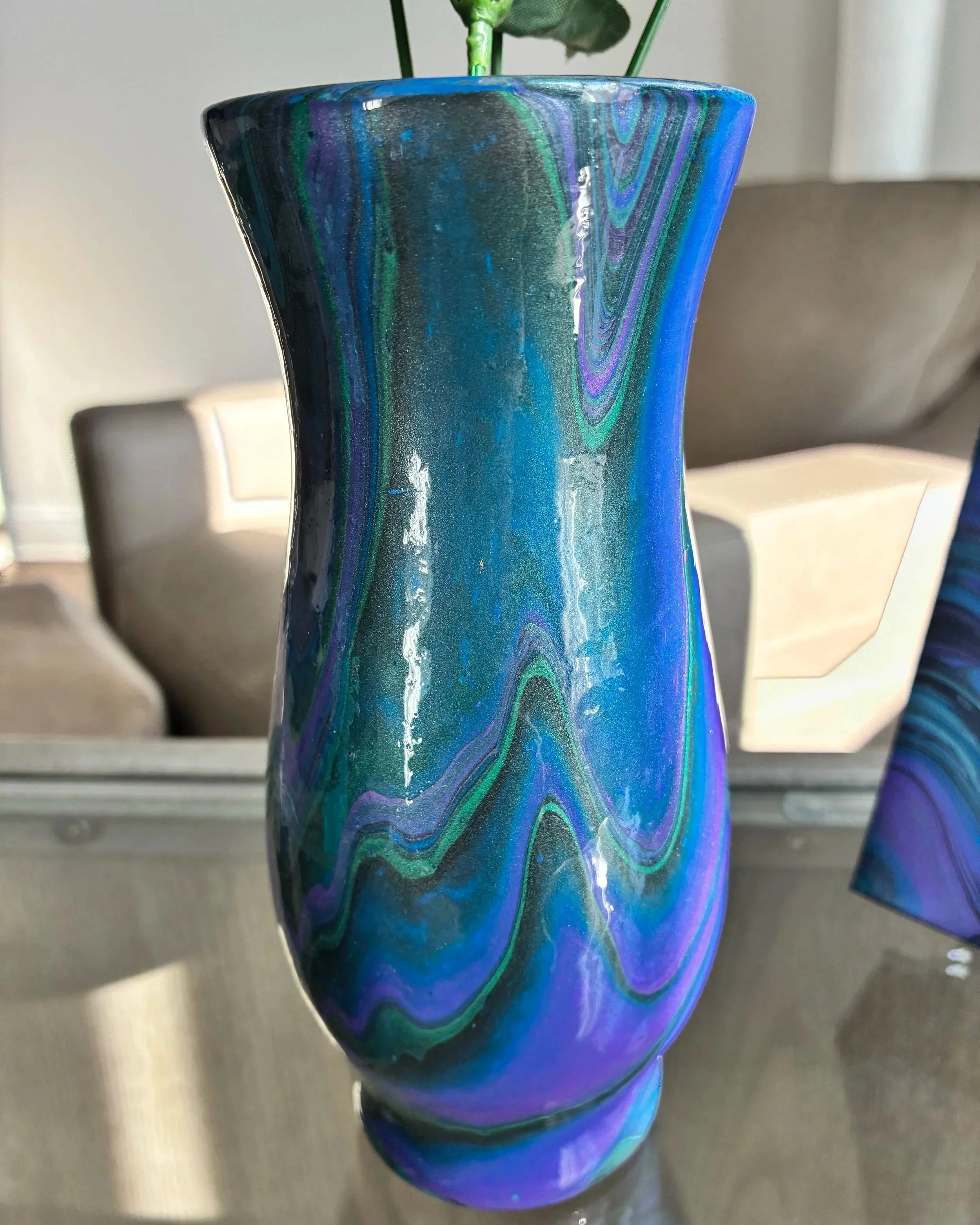 Iridescent blue and violet marbled vase with flowing acrylic pour details styled with white flowers from the Midnight Aura collection by DesignsbyLaDia