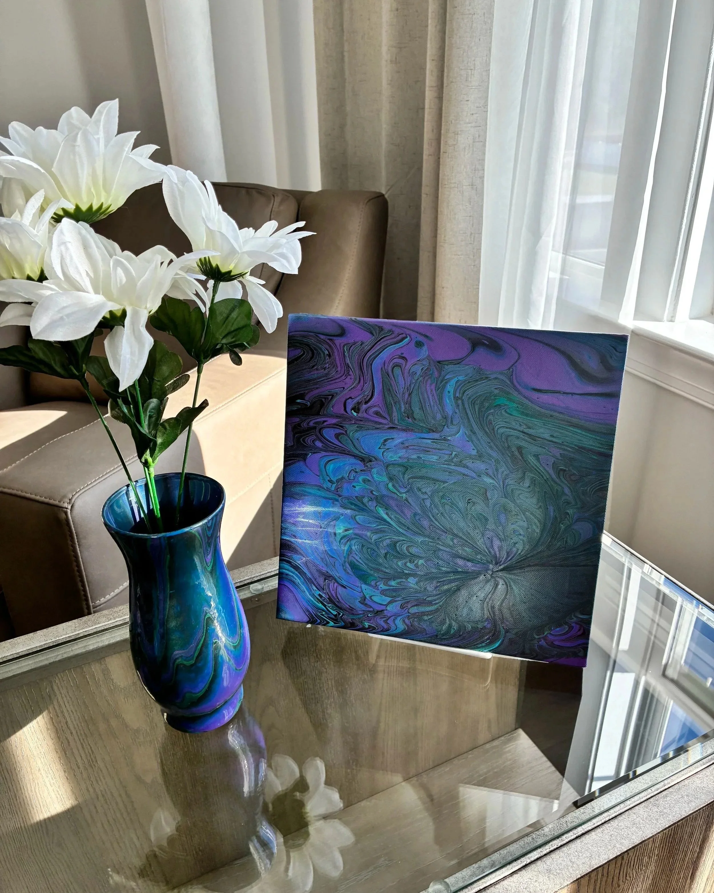 Luxury abstract vase and canvas set styled in a modern neutral living space with rich navy, sapphire, and metallic accents.