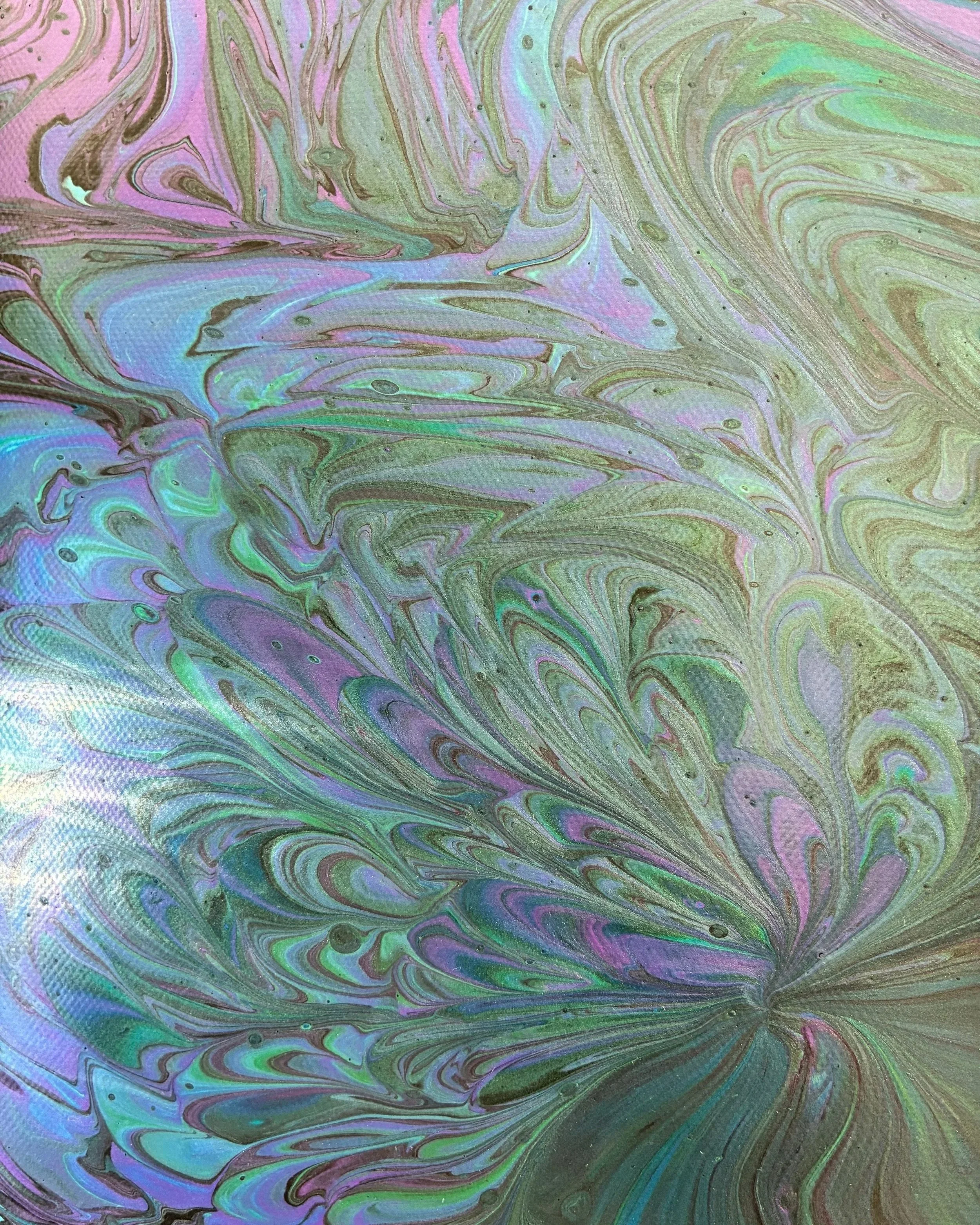 Iridescent abstract acrylic pour artwork featuring fluid marbled movement in soft pink, purple, teal, blue, and gold tones..