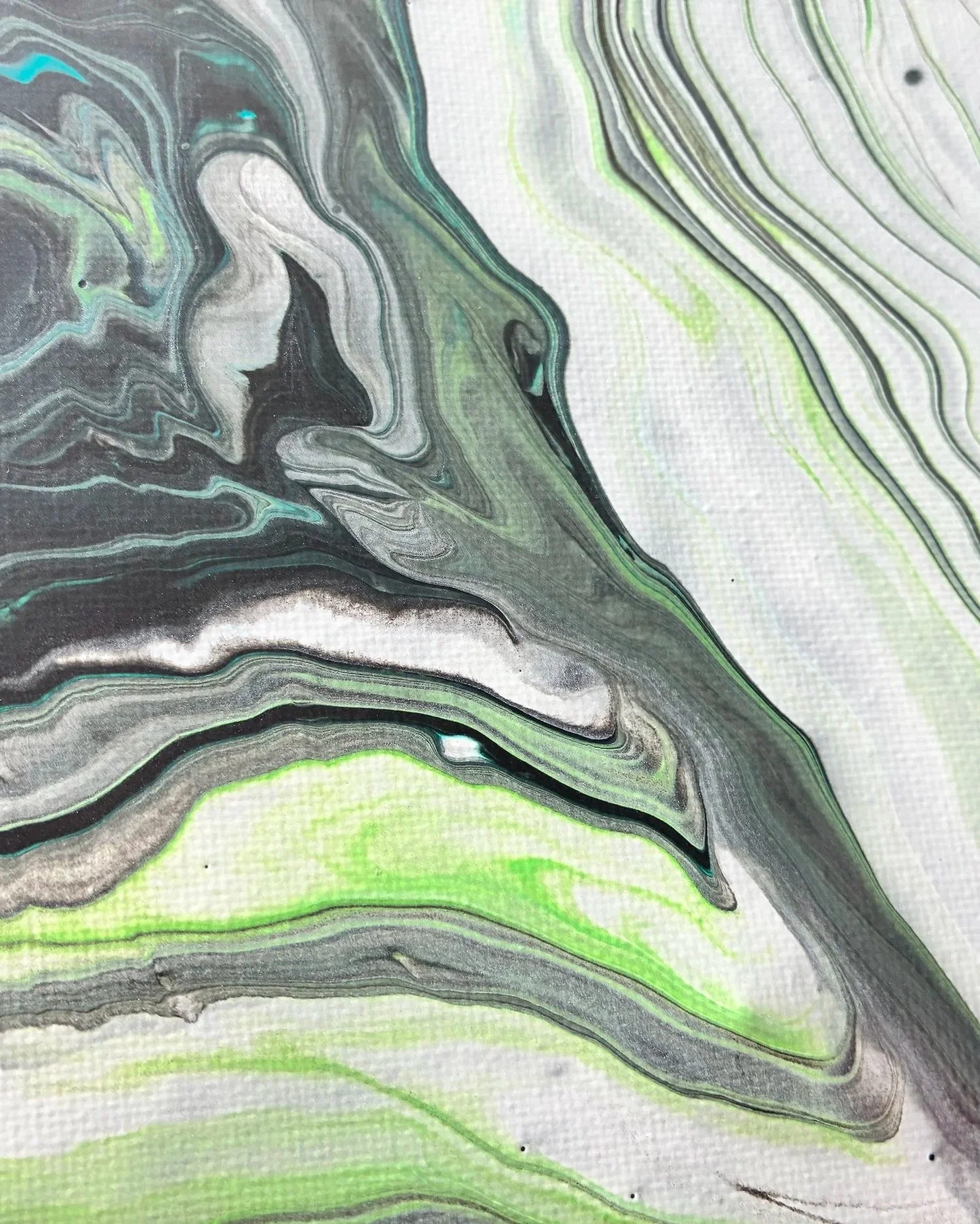 Close-up detail of layered emerald, ivory, and charcoal movement inspired by natural stone formations and flowing mineral lines.