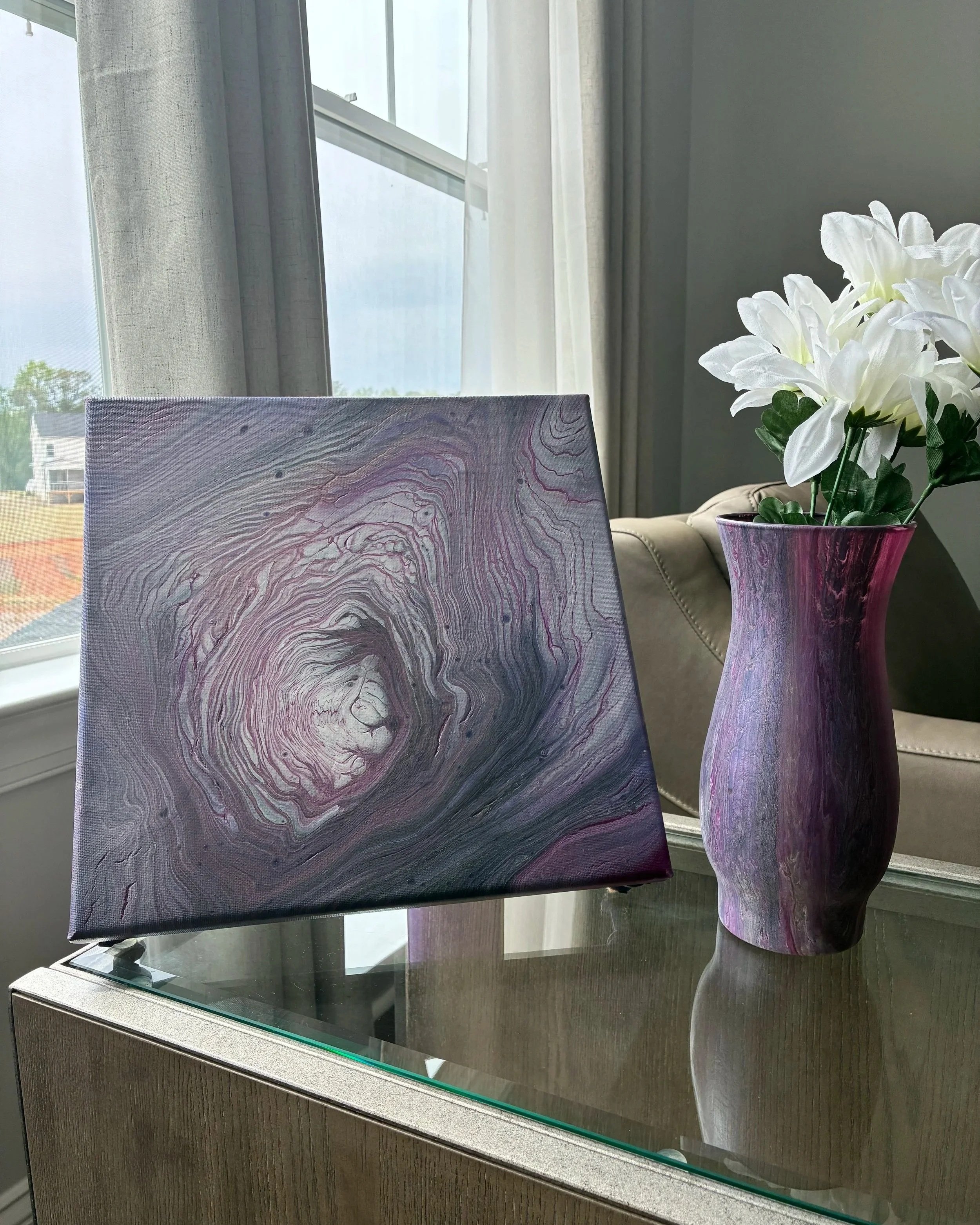 A coordinating pairing from the Amethyst Veil collection featuring fluid violet movement, soft metallic tones, and modern luxury styling.