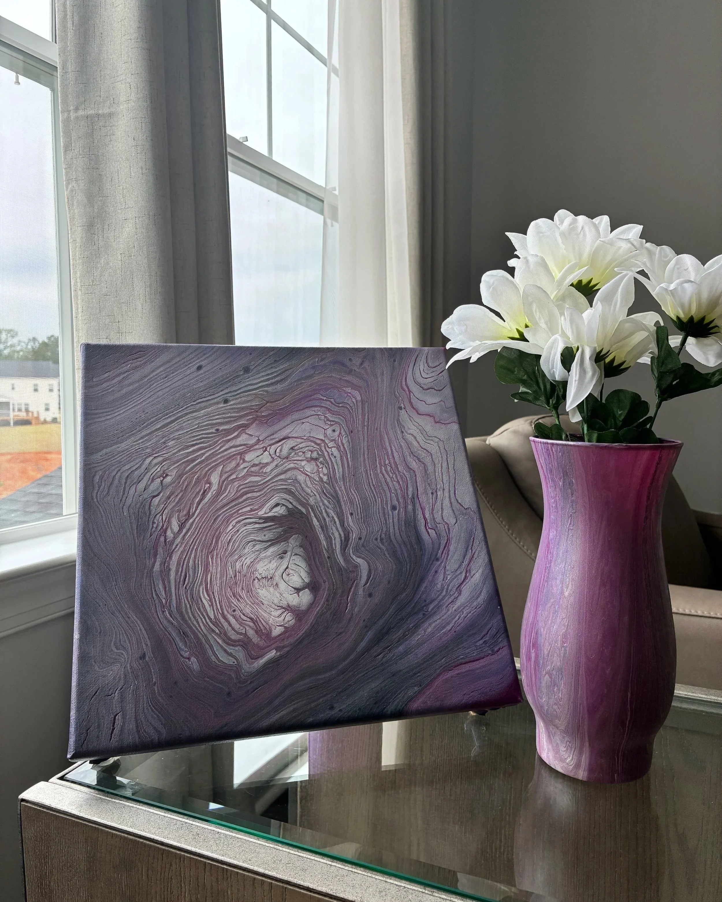 A moody lavender pairing of fluid movement, layered texture, and soft floral styling designed to bring modern elegance into any space.