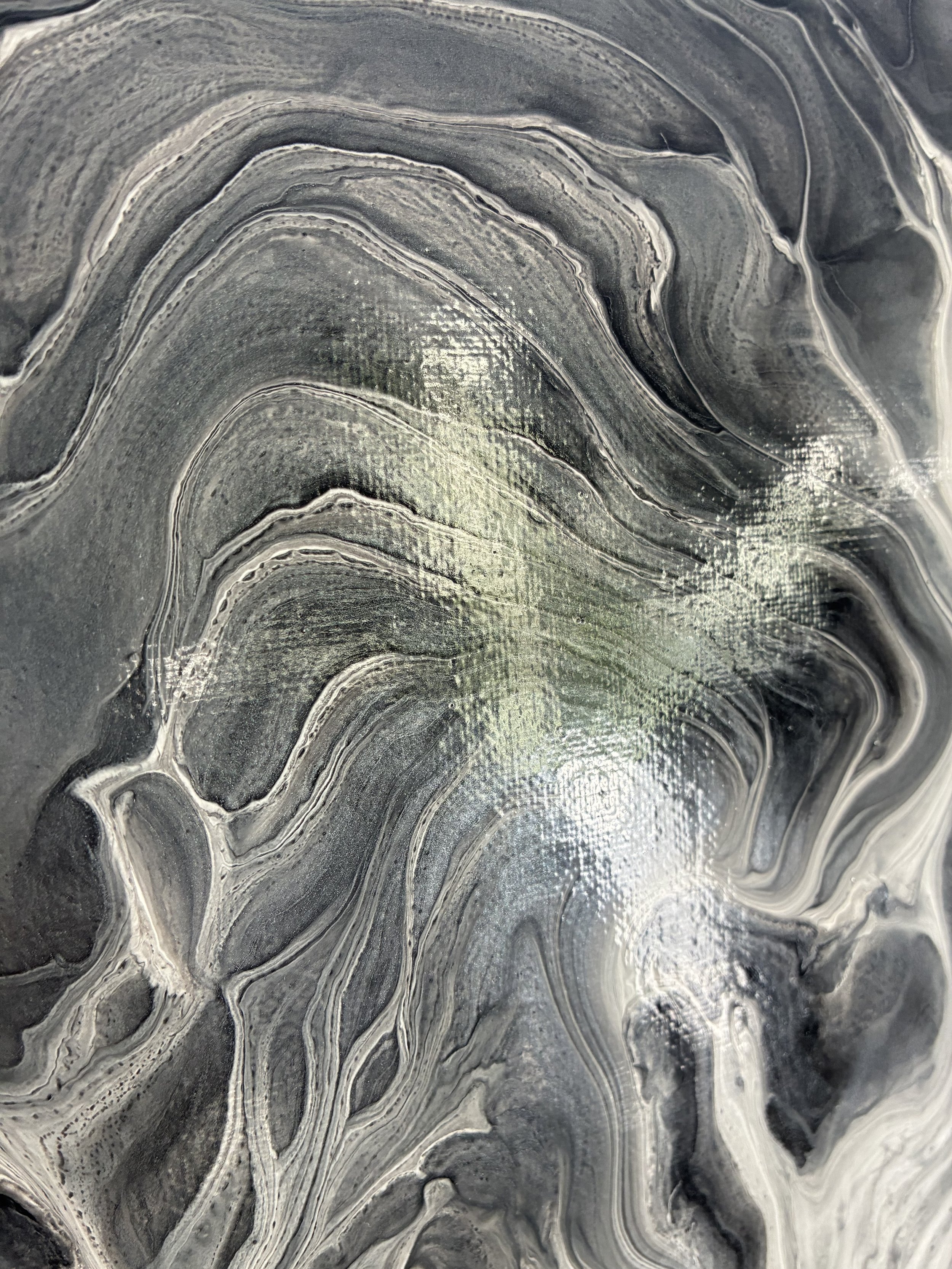 Close-up detail of Phantom Vein, highlighting layered black, silver, and white veining inspired by natural stone formations.