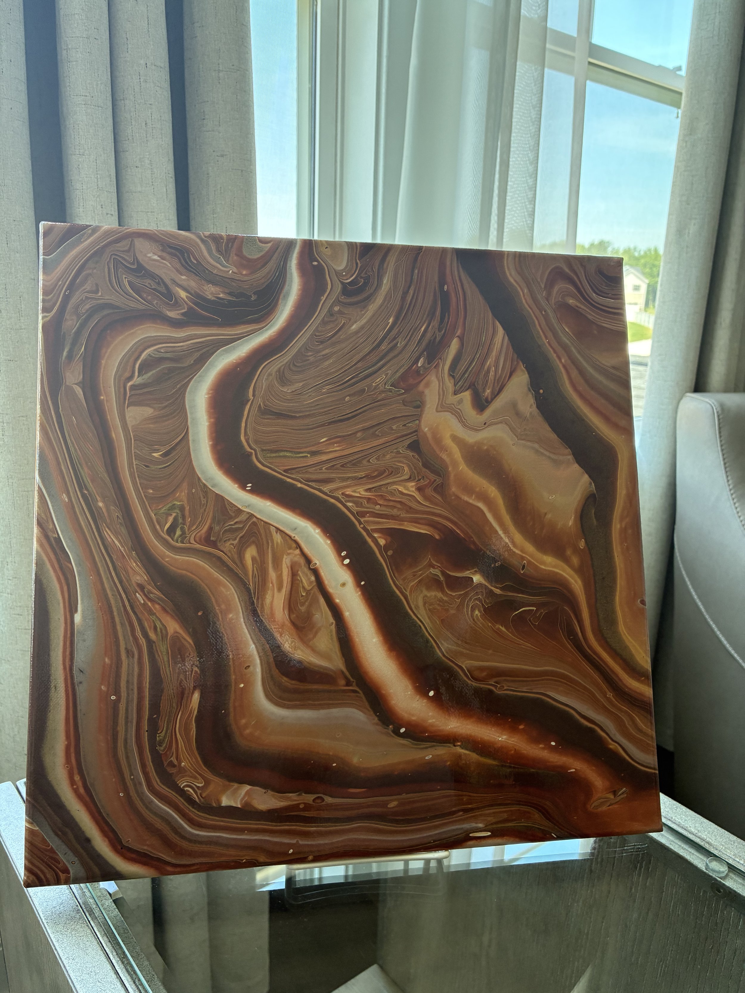 Rich bronze and copper currents weave through shadowed layers, creating a landscape of movement and timeless elegance.