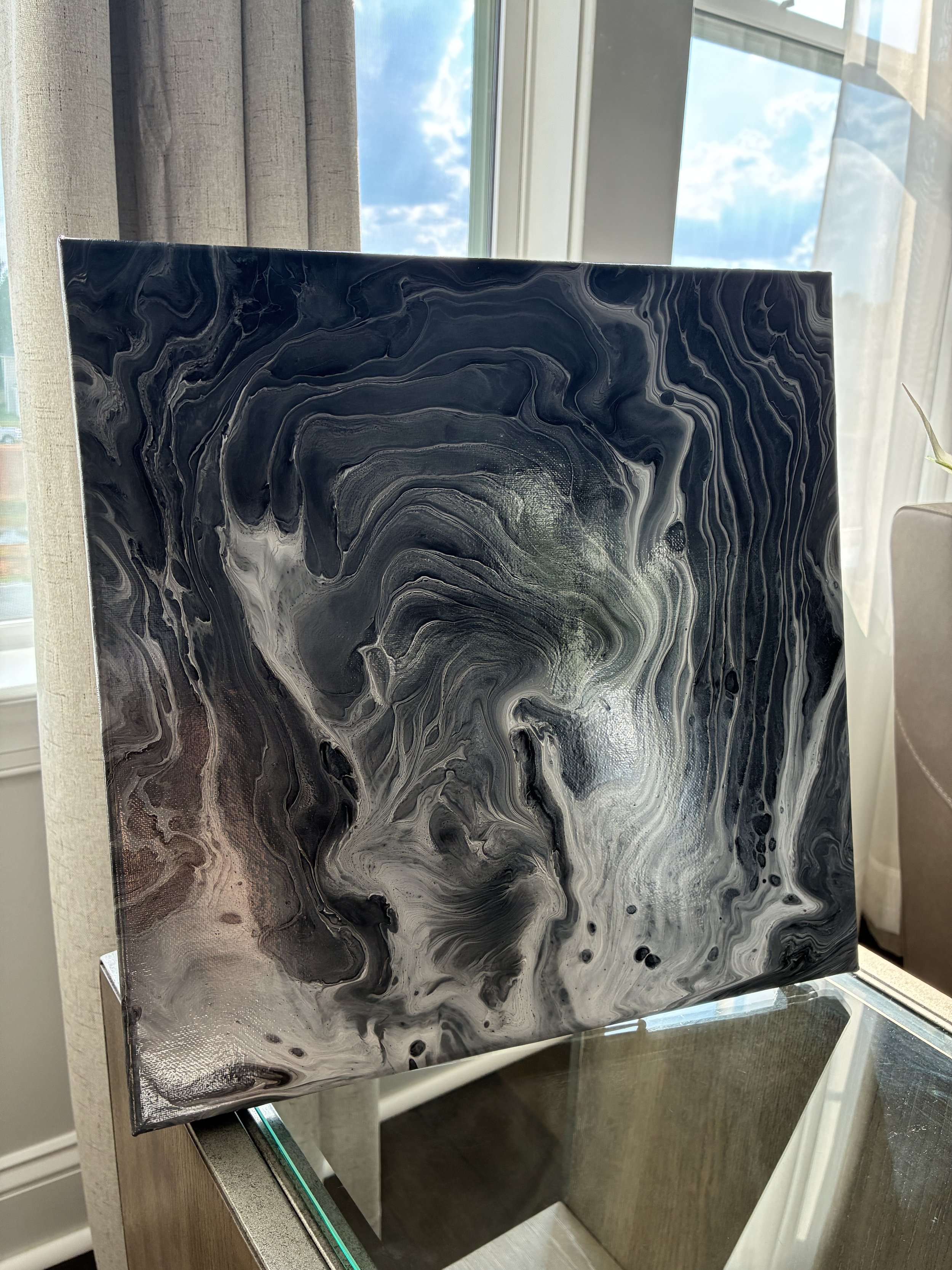 Flowing black, silver, and white veining creates a striking statement piece inspired by natural stone