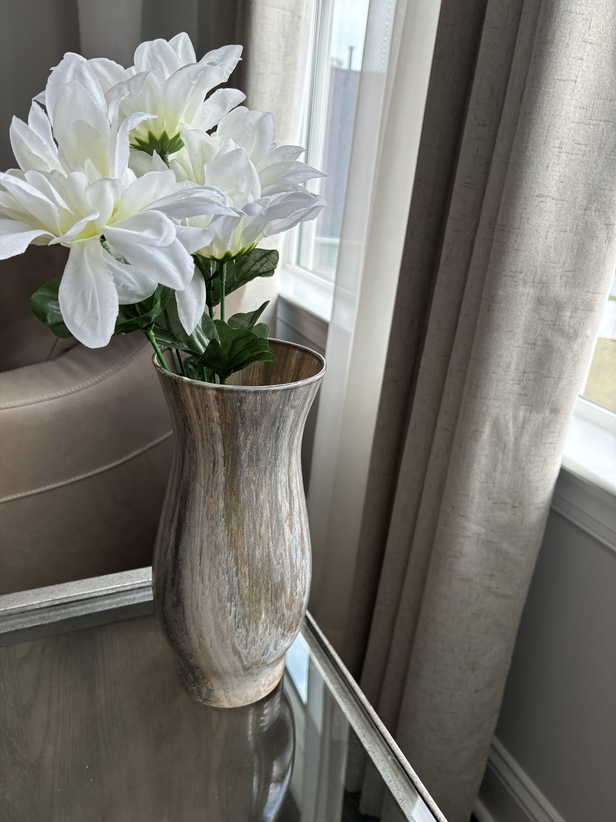 Stone Bloom from the Stone Whisper Collection — organic marbling and warm stone-inspired movement in a sculptural vessel form.