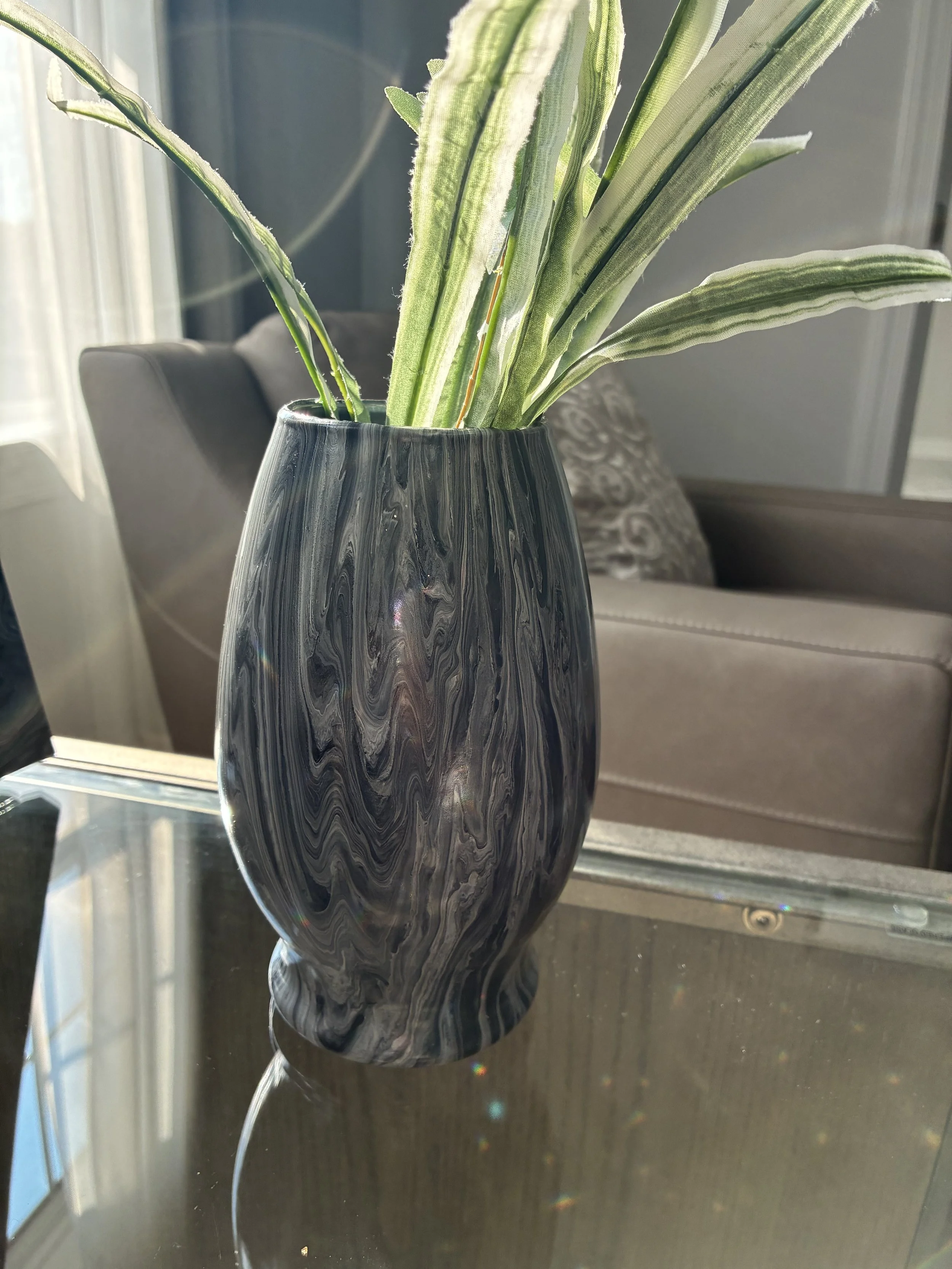 Elegant black and silver veining creates a bold yet sophisticated statement vessel.