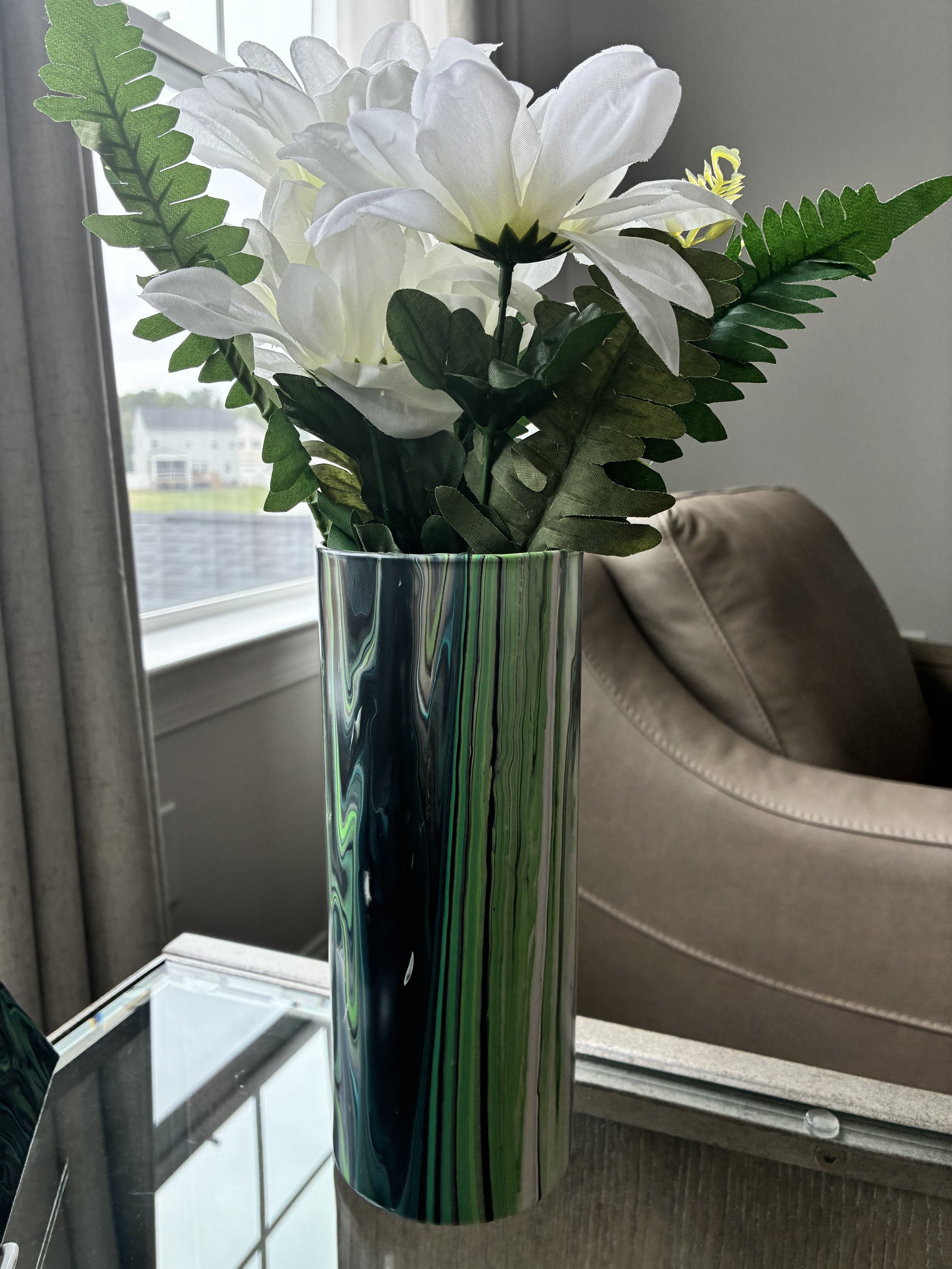 Hand-painted decorative vase with green, white, and black marble acrylic pour detailing.