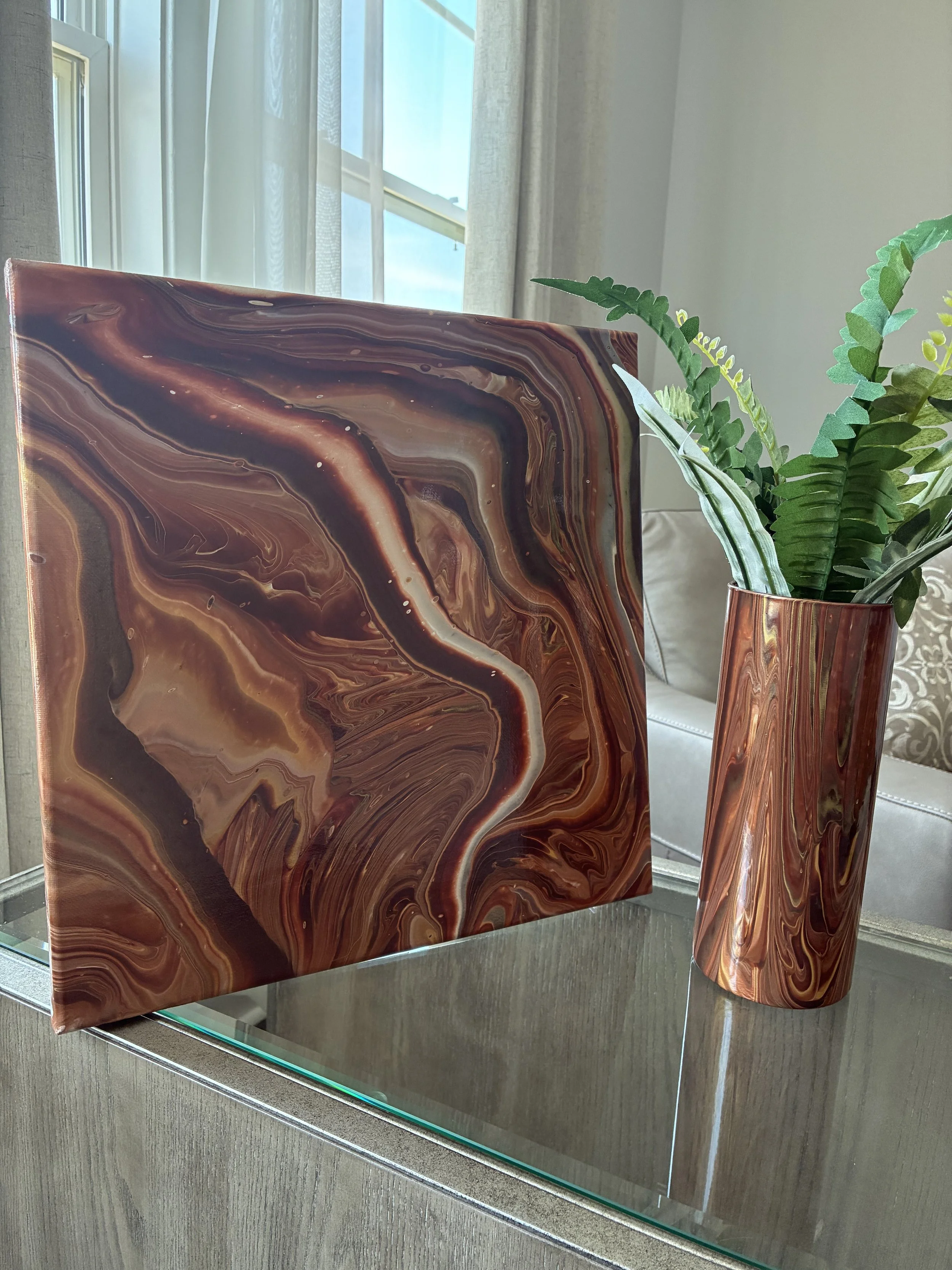 An exploration of earth-inspired movement and modern luxury through handcrafted abstract art. Earthbound Echo and Whispered Canyon unite in warm bronze, copper, and stone-toned currents.