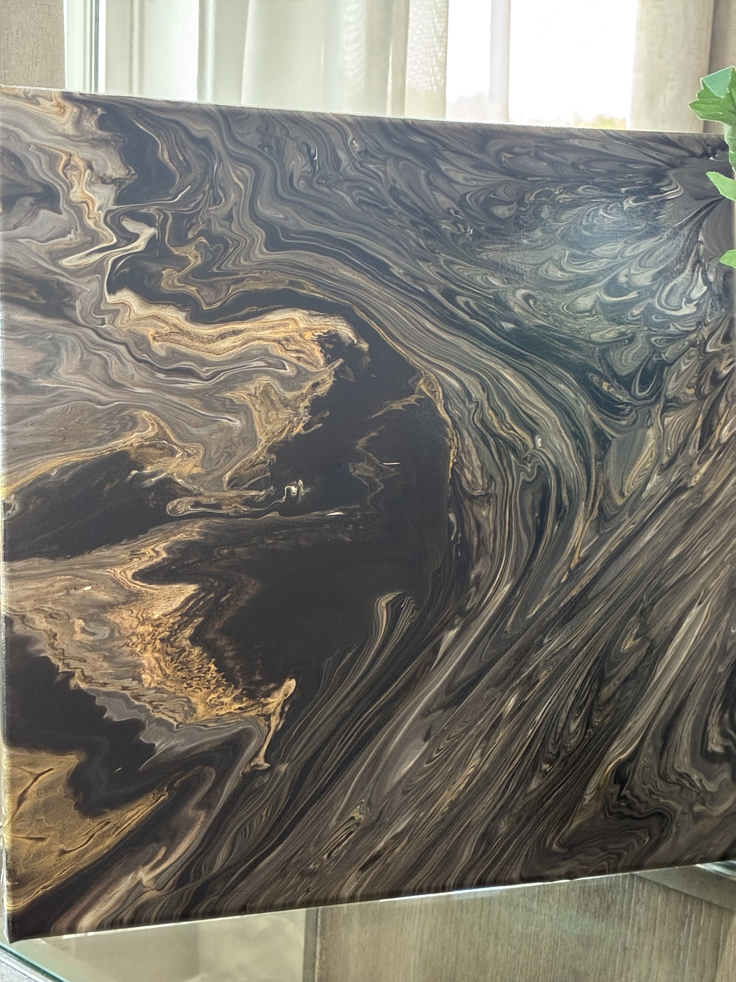 Dark currents of black, charcoal, and bronze flow through layers of metallic depth, evoking the beauty of polished stone and hidden mineral veins