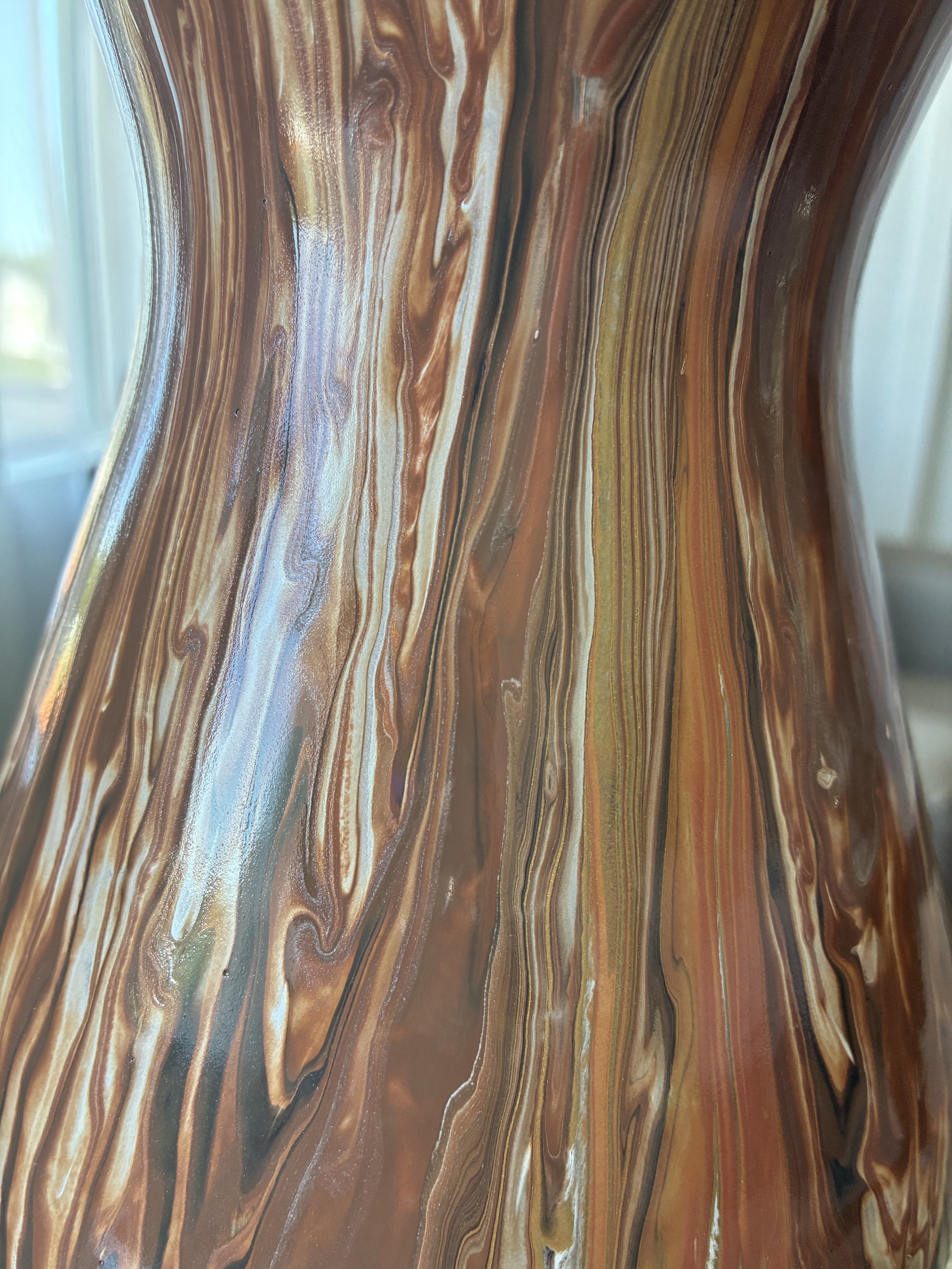A close-up view of Molten Veil, highlighting flowing ribbons of copper, bronze, pearl, and smoky charcoal tones within the handcrafted acrylic pour design