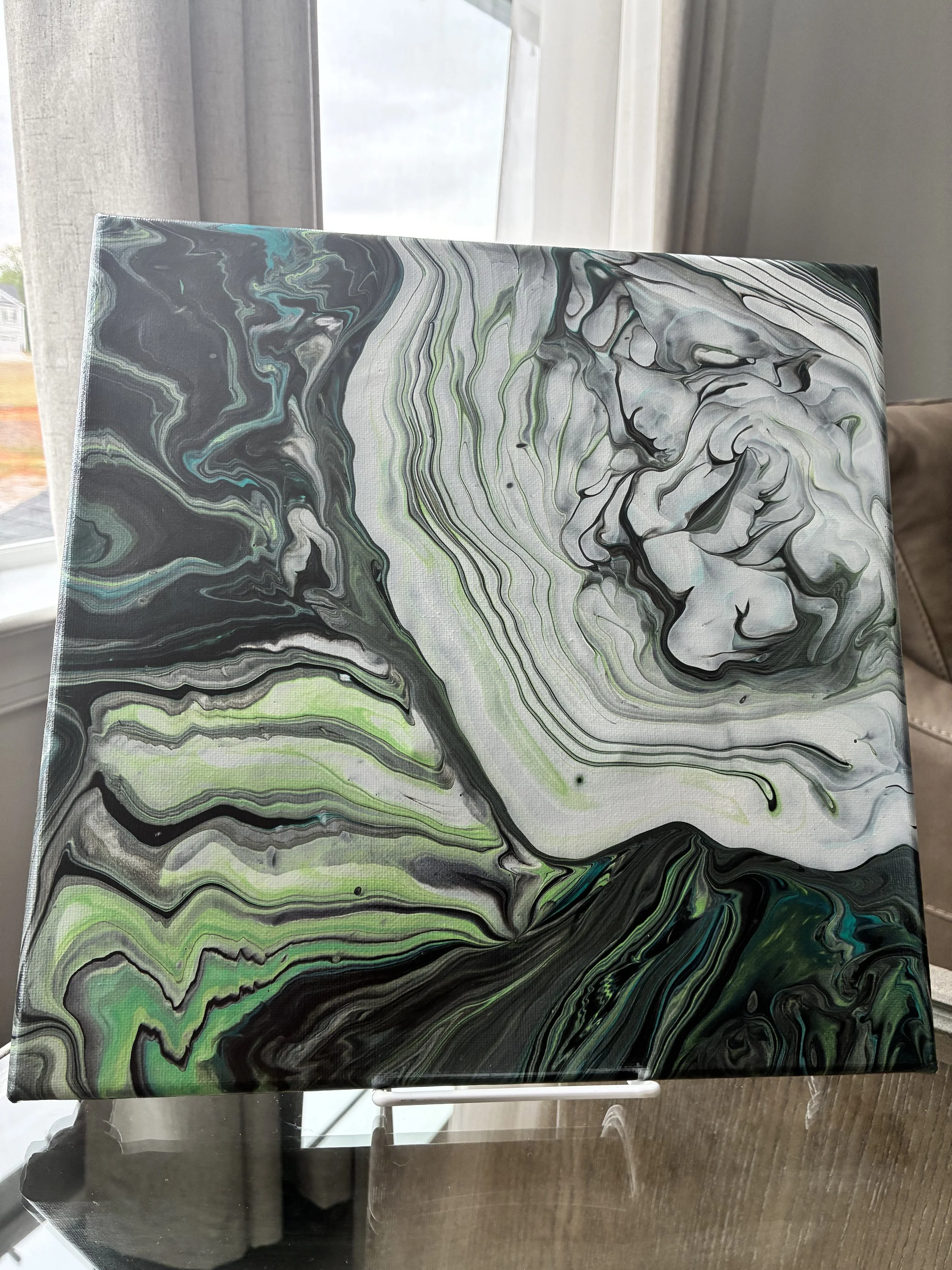 Green, black, and silver abstract acrylic pour canvas with flowing marble movement and layered vein details.