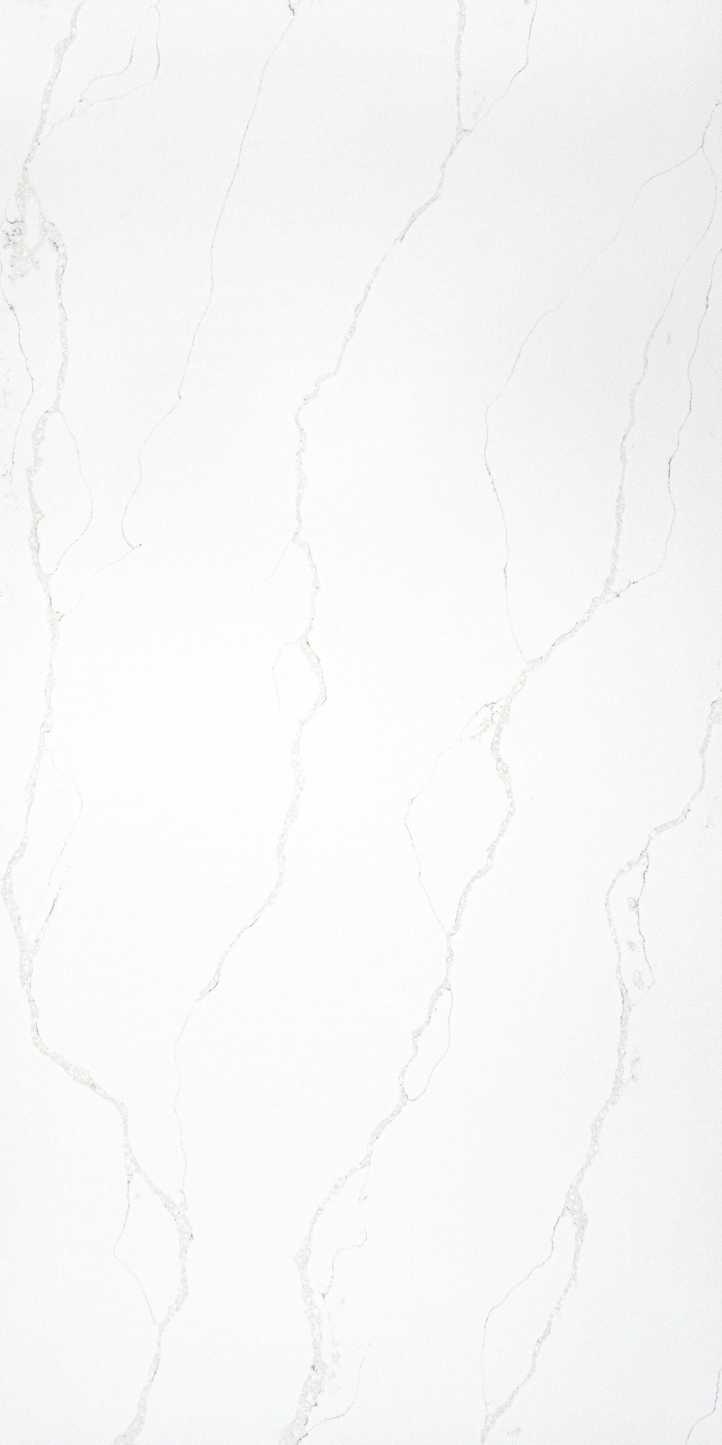 A white marble surface with light beige veining.