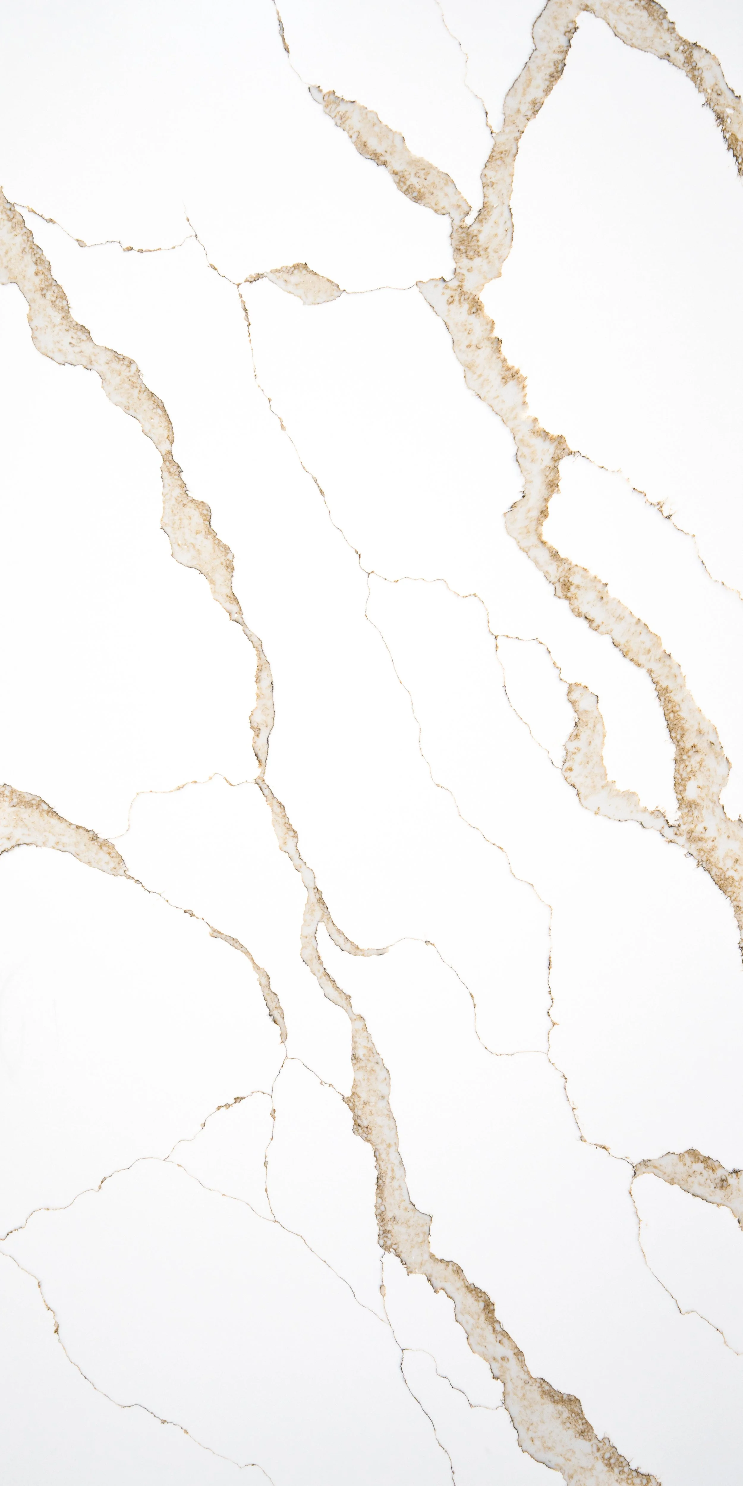 White marble surface with brown and beige veining.