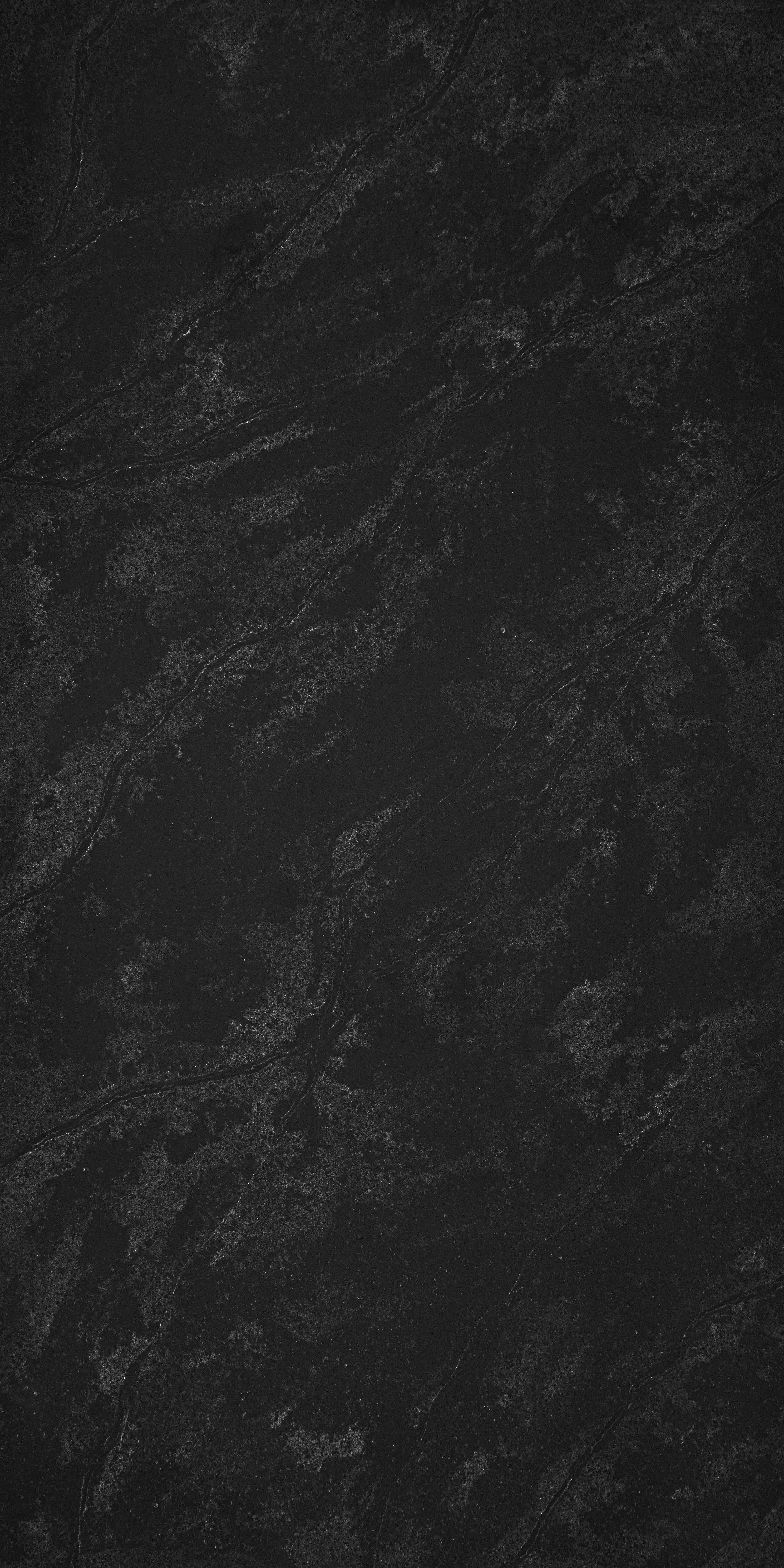 A black marble surface with subtle gray veining.