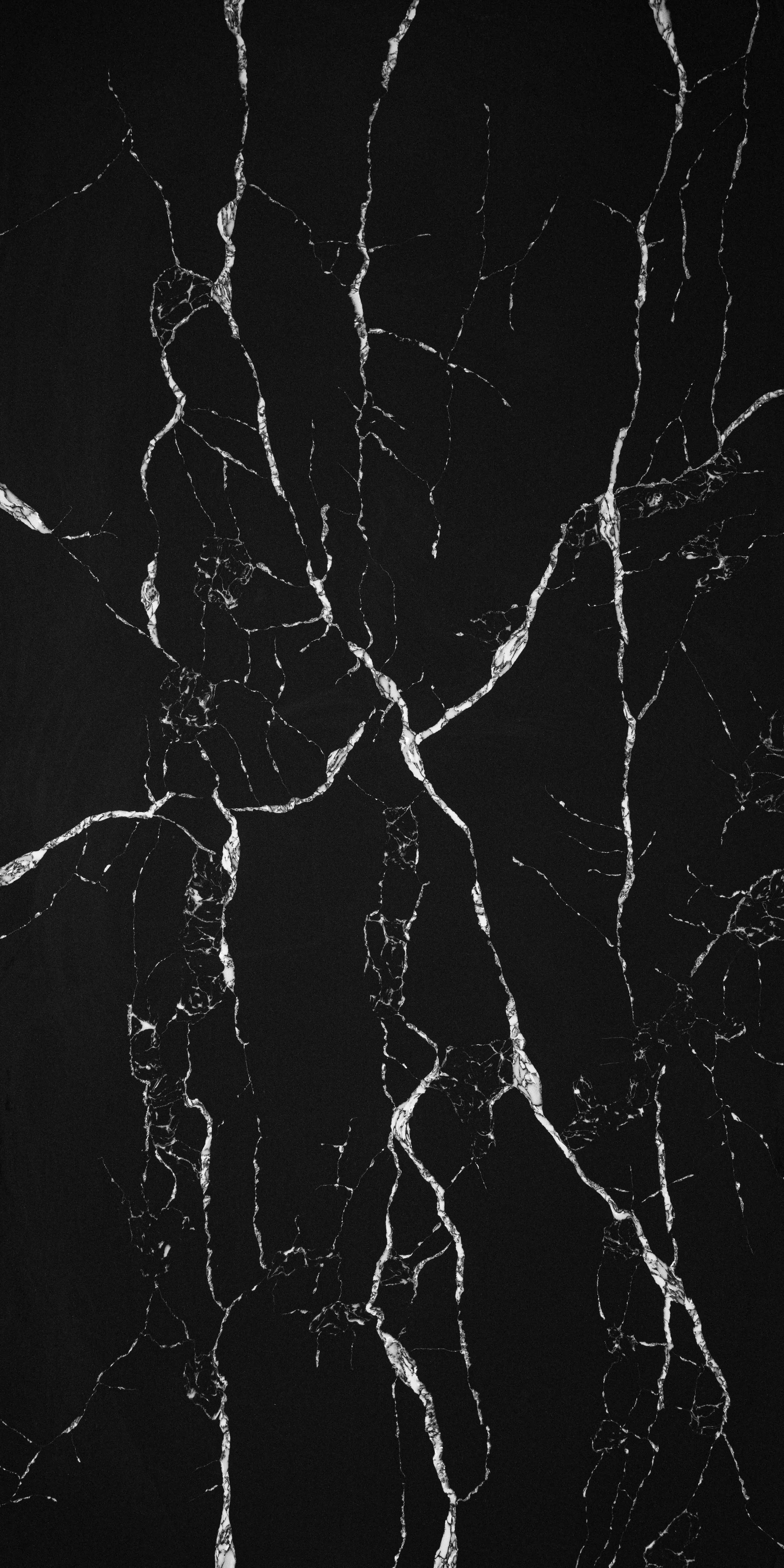 Black marble surface with white and gray veining.