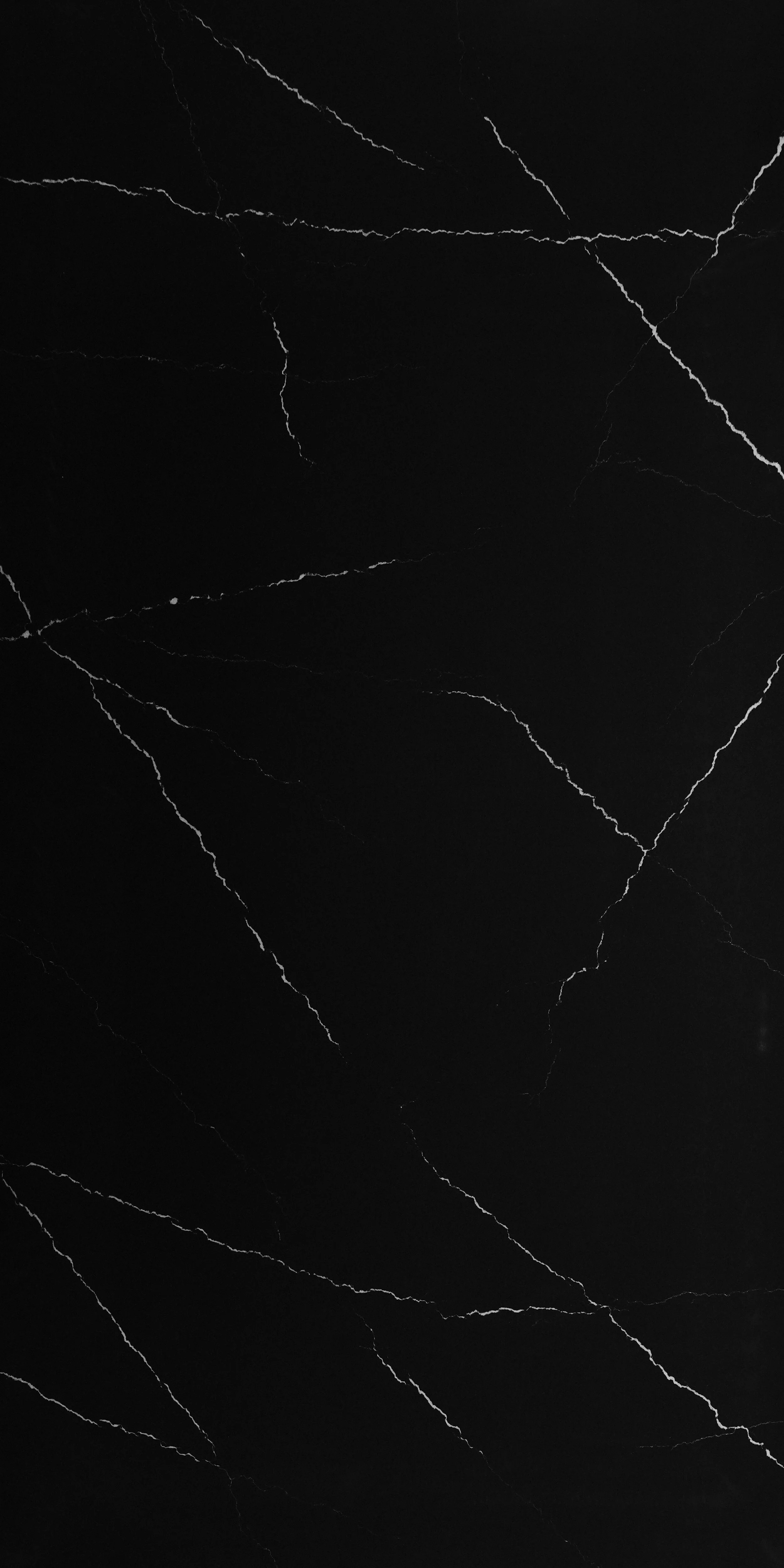Black marble surface with white veining.