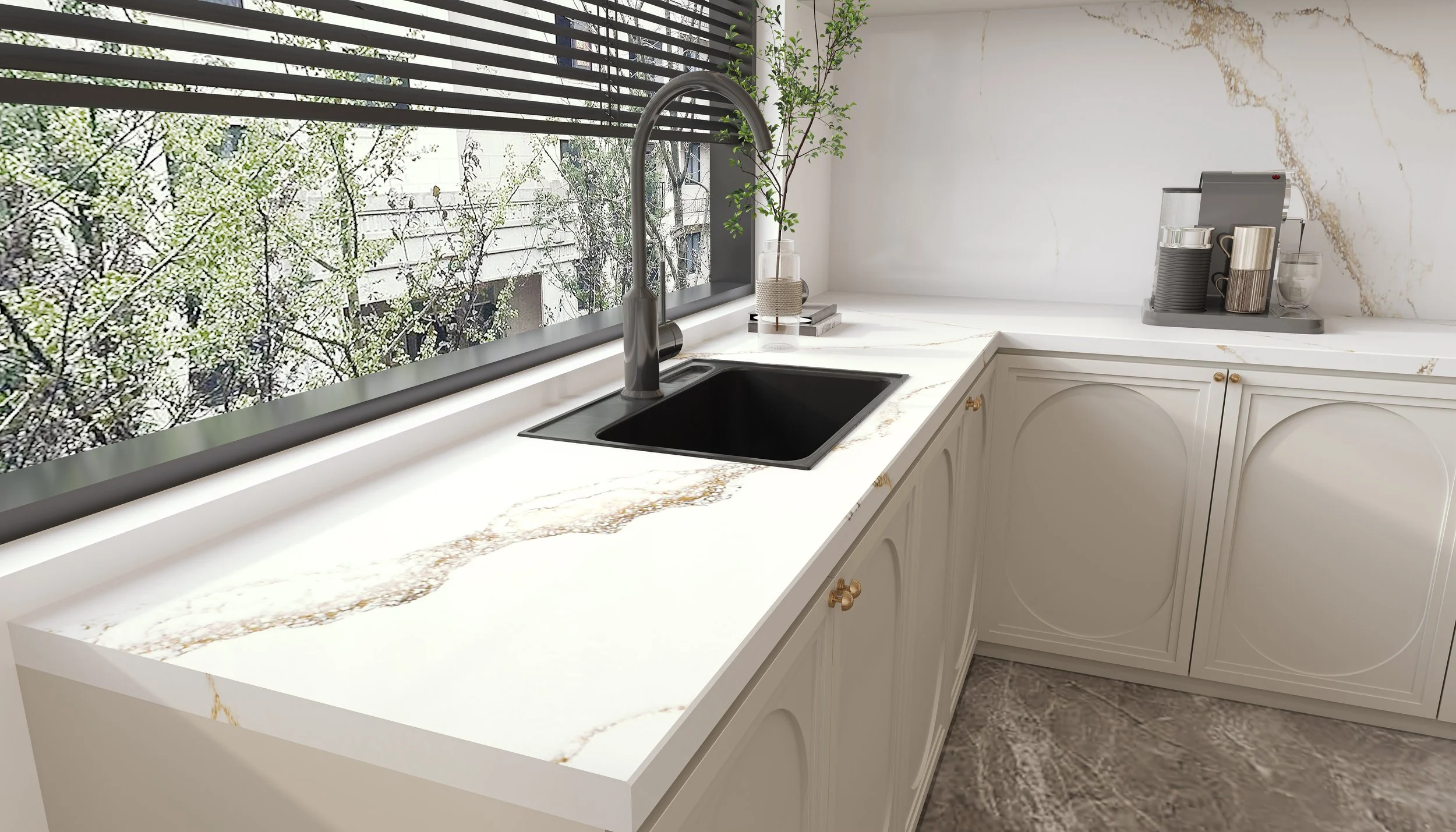 Modern kitchen with white marble countertop, black sink, and a window with blinds overlooking trees.