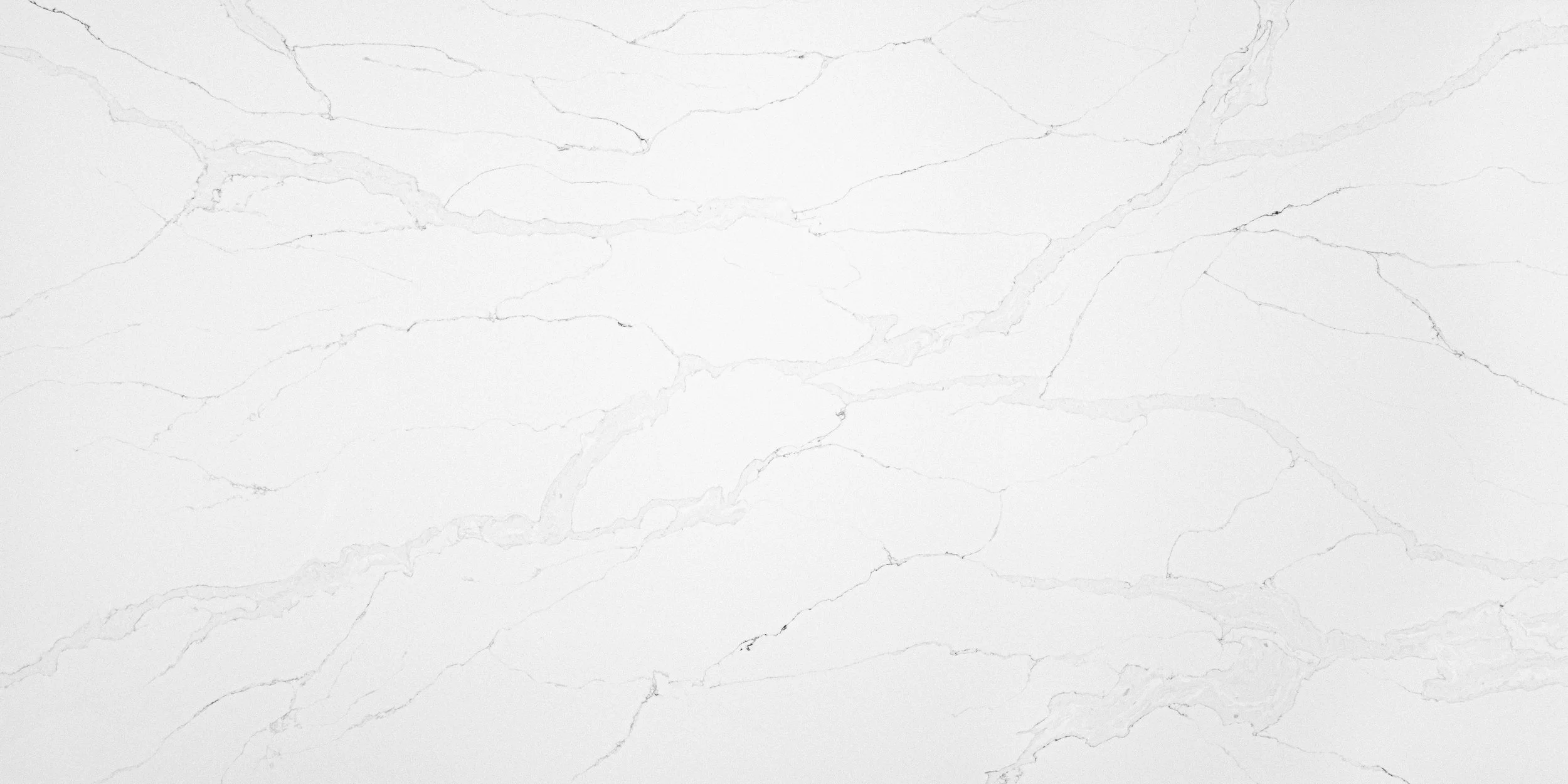 White marble surface with subtle gray veining.
