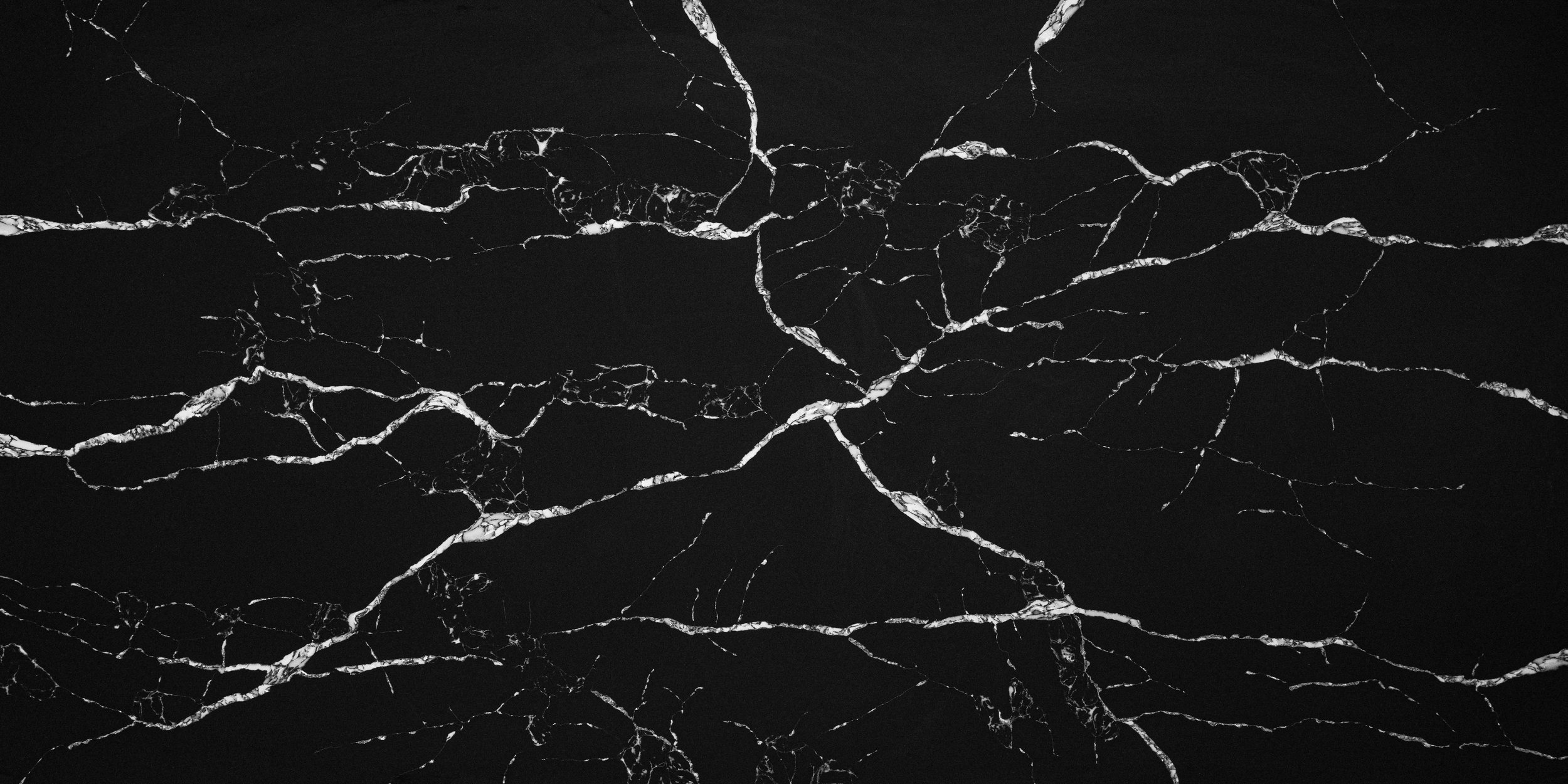 Black marble surface with white veining.