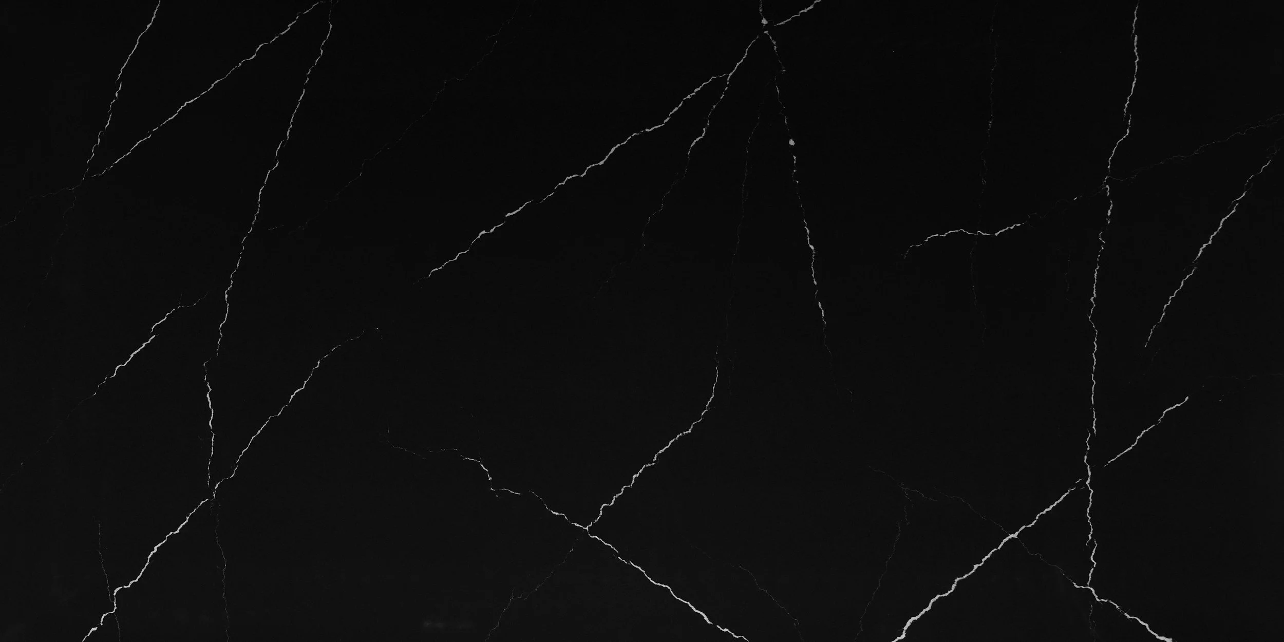 A black marble surface with white veining.