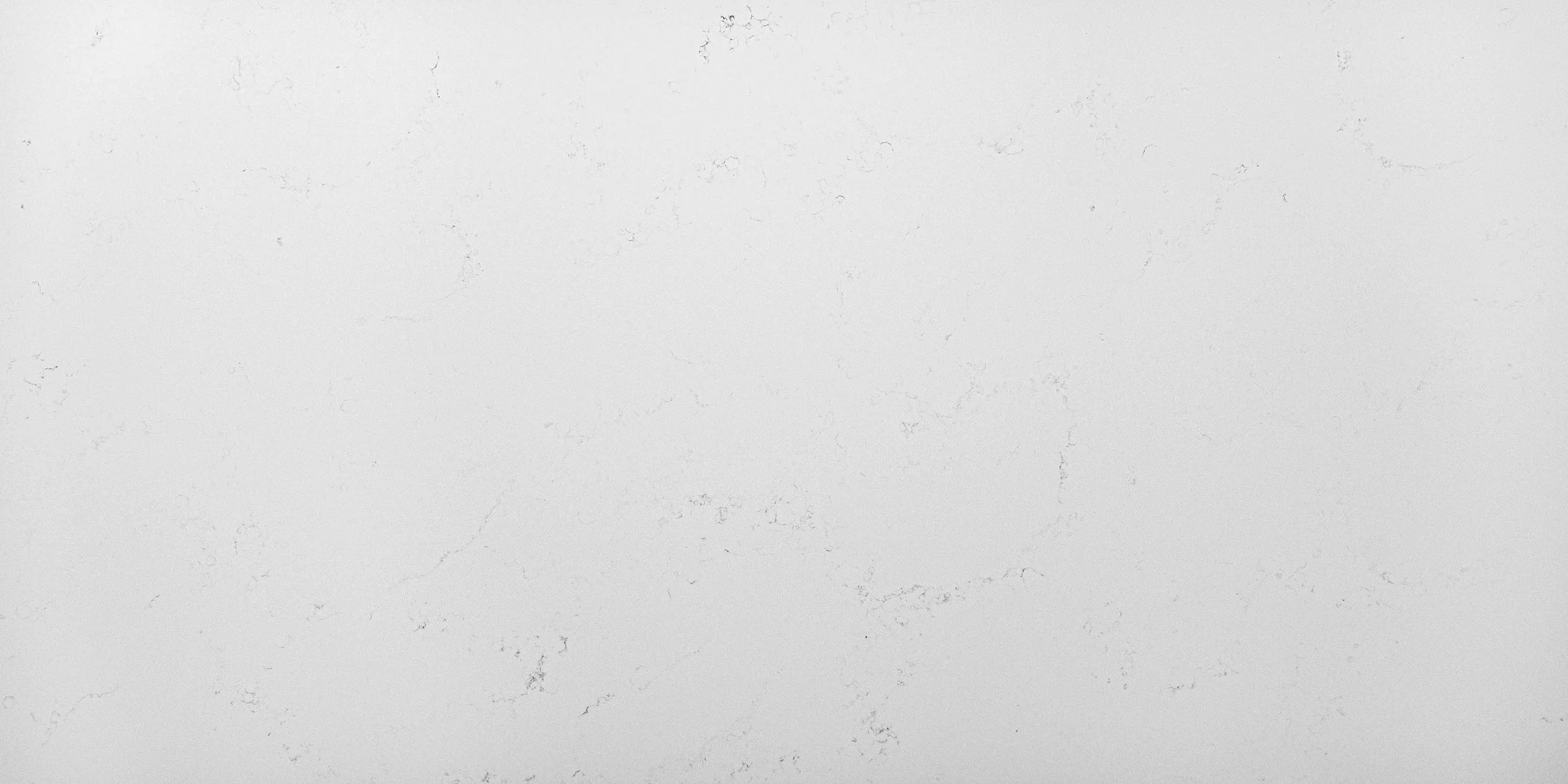 Empty white marble surface with subtle gray veining.