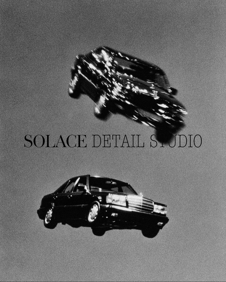 Black and white animated image of two cars floating in mid-air with the text 'SOLACE DETAIL STUDIO' between them.