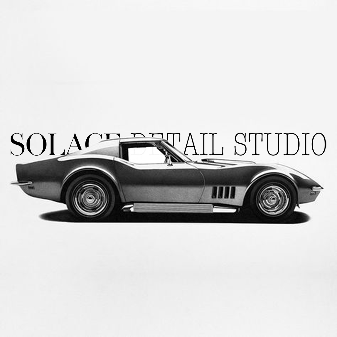 Black vintage sports car against white background with text 'Solace Detail Studio' overlayed.