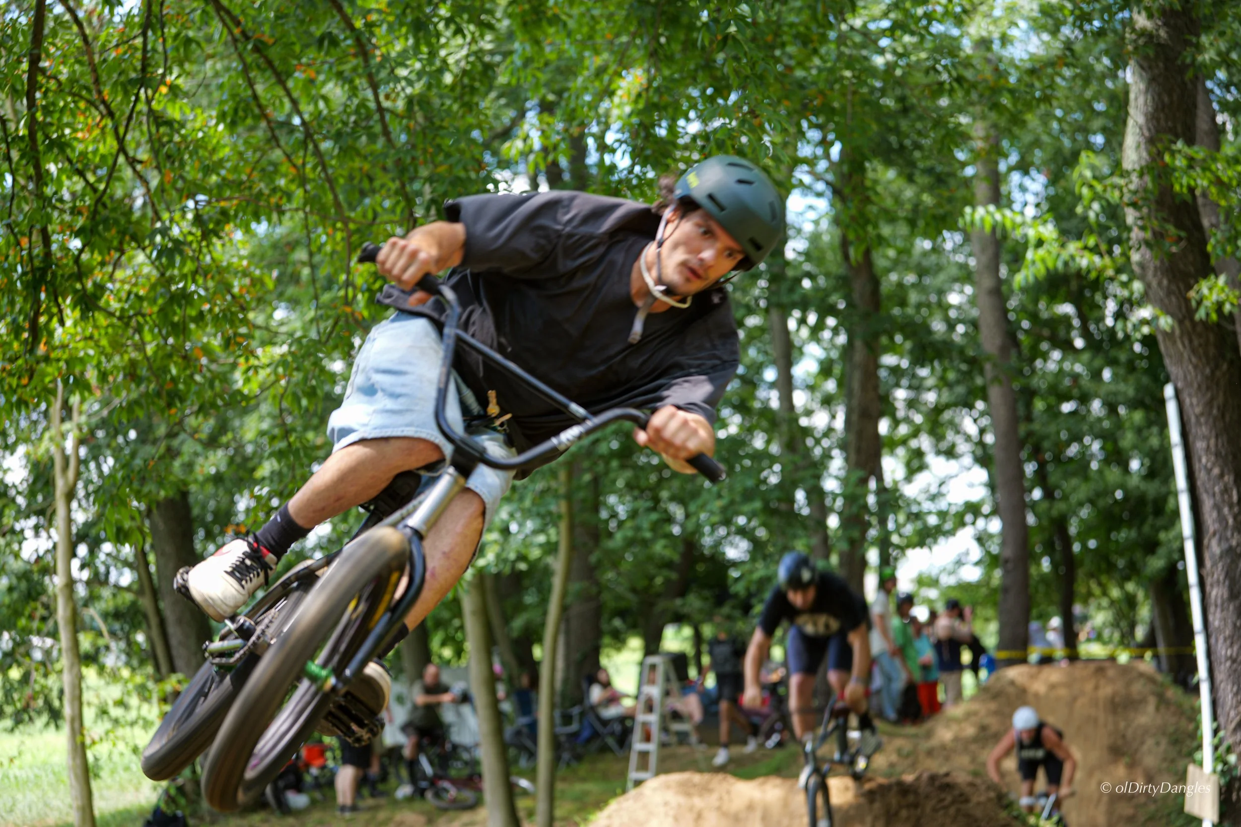 Jake Lord catching air into a berm at Apple Creek, Ohio BMX Trail Series 2026 - Photo by OlDirty Dangles